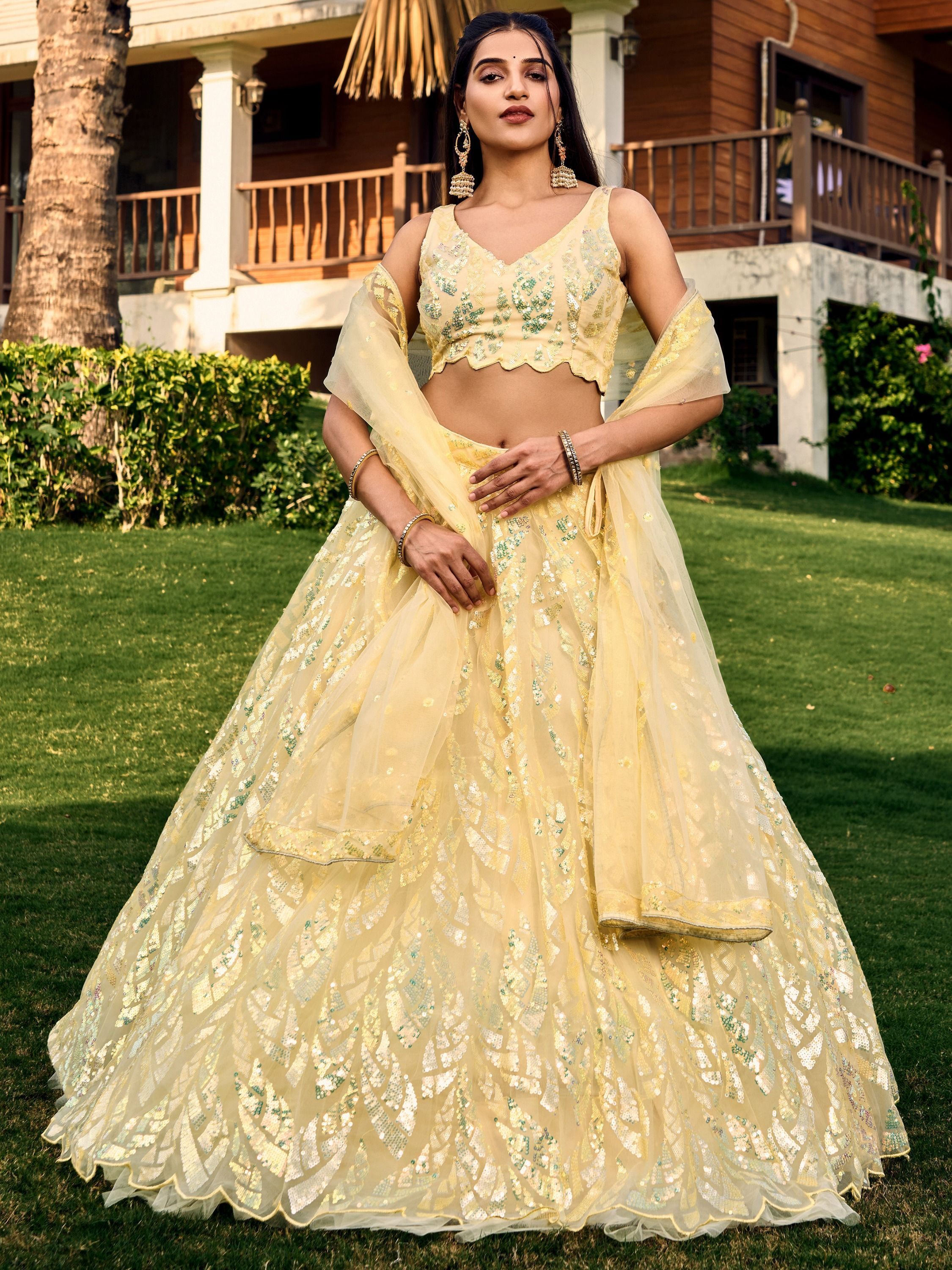 Yellow soft net lehenga choli with heavy multi sequins embroidery and lace border dupatta perfect for weddings receptions and glam parties