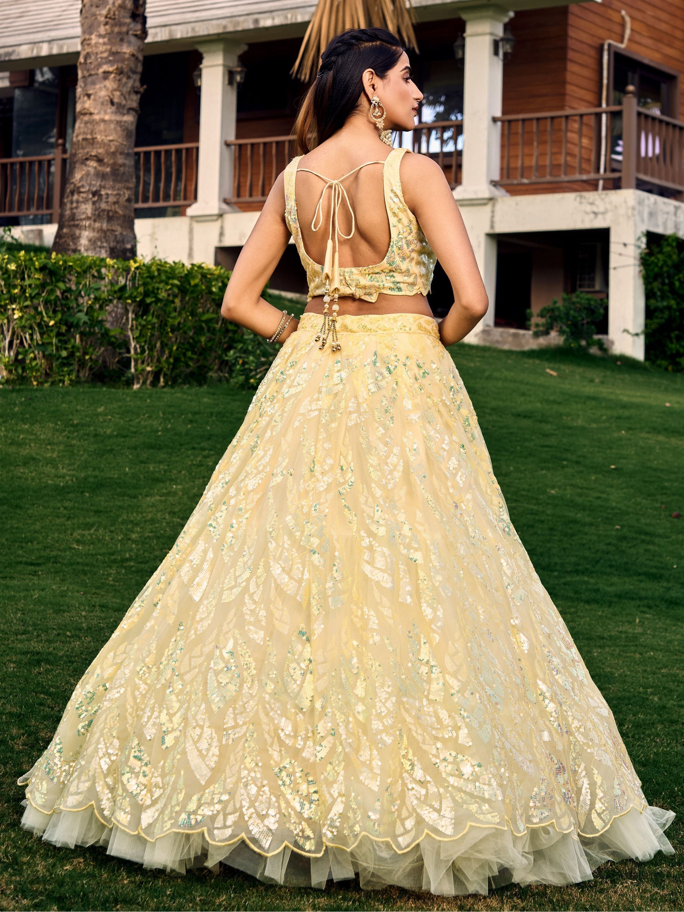 Yellow soft net lehenga choli with heavy multi sequins embroidery and lace border dupatta perfect for weddings receptions and glam parties