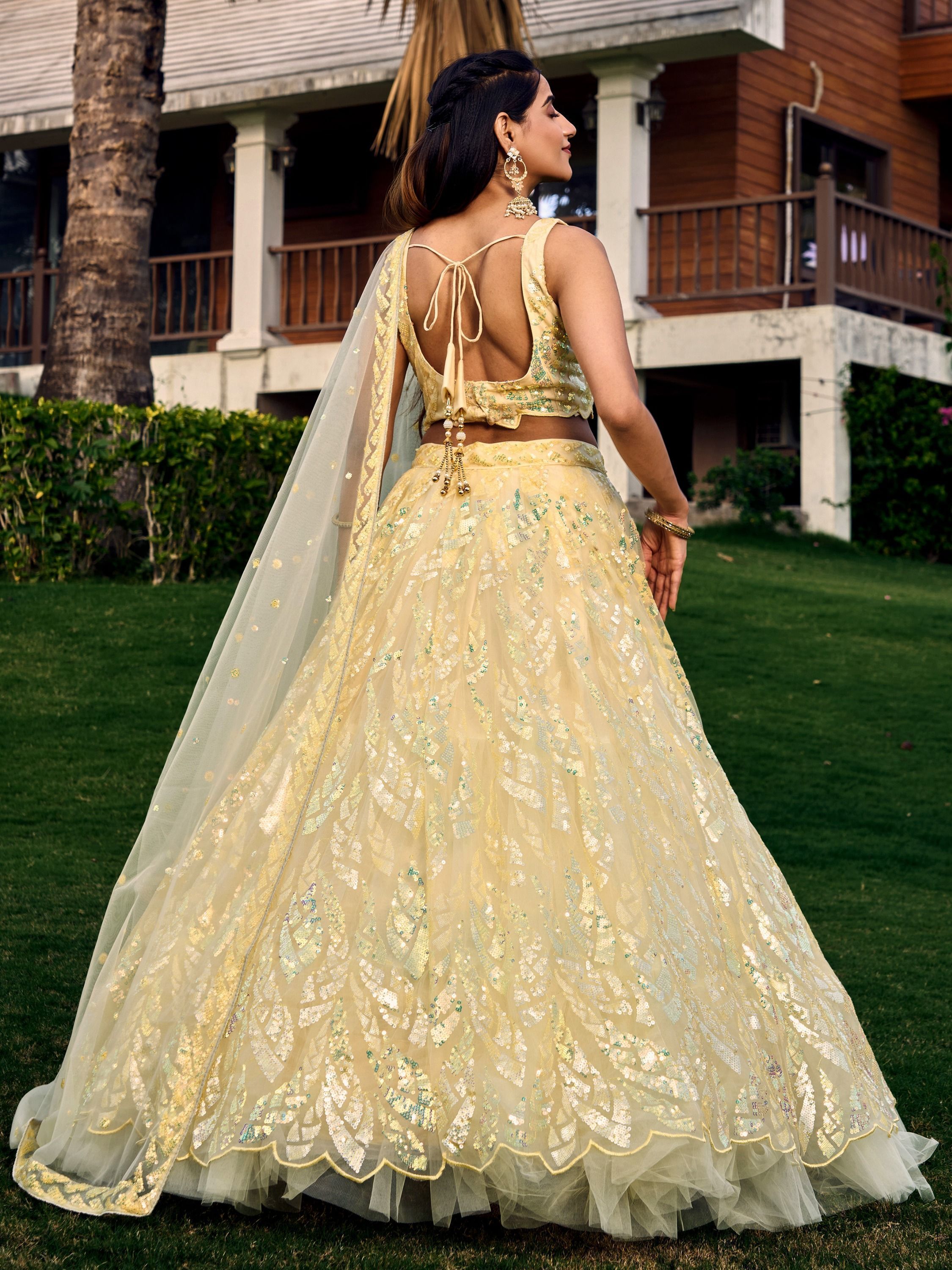 Yellow soft net lehenga choli with heavy multi sequins embroidery and lace border dupatta perfect for weddings receptions and glam parties