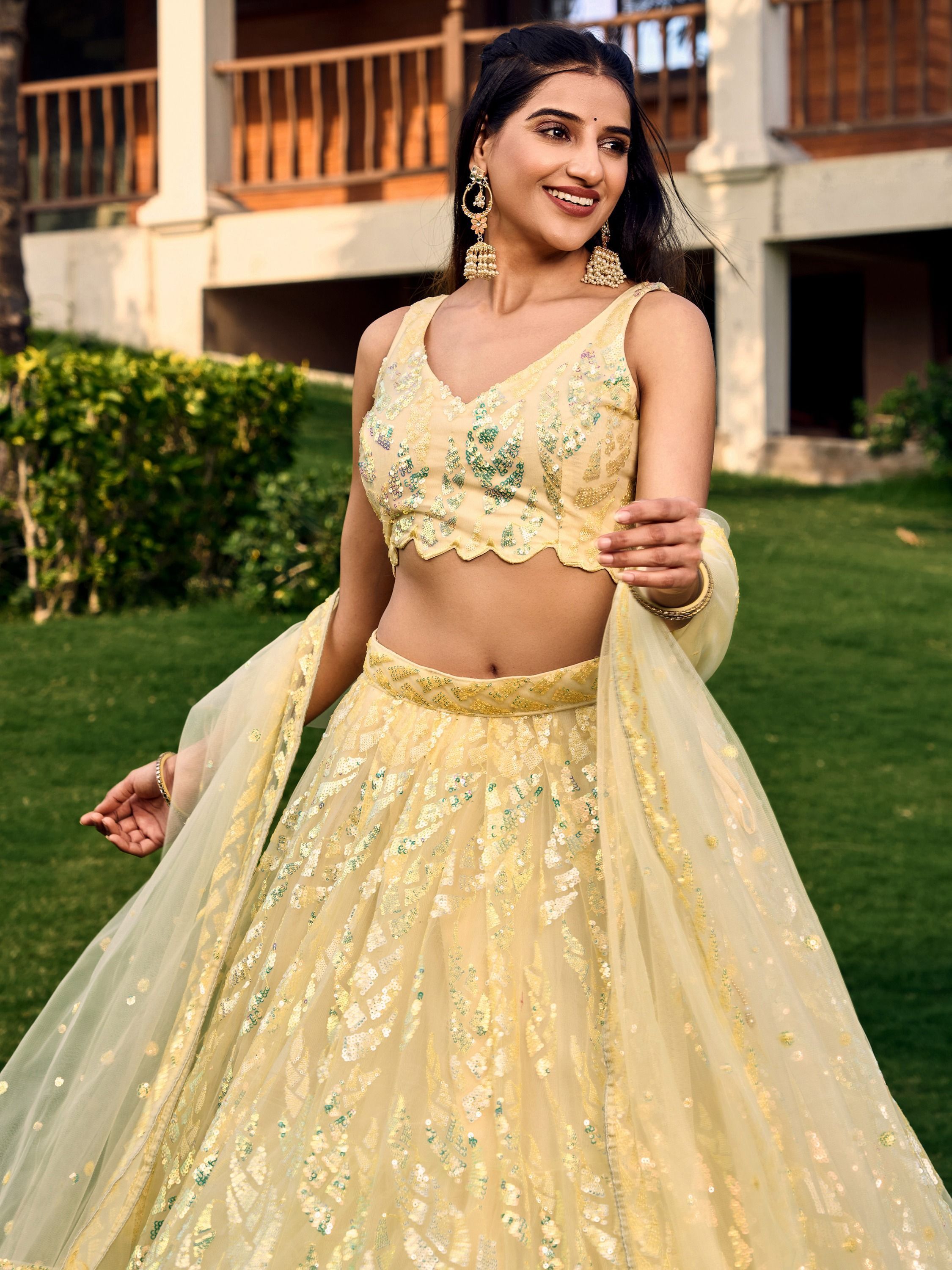 Yellow soft net lehenga choli with heavy multi sequins embroidery and lace border dupatta perfect for weddings receptions and glam parties