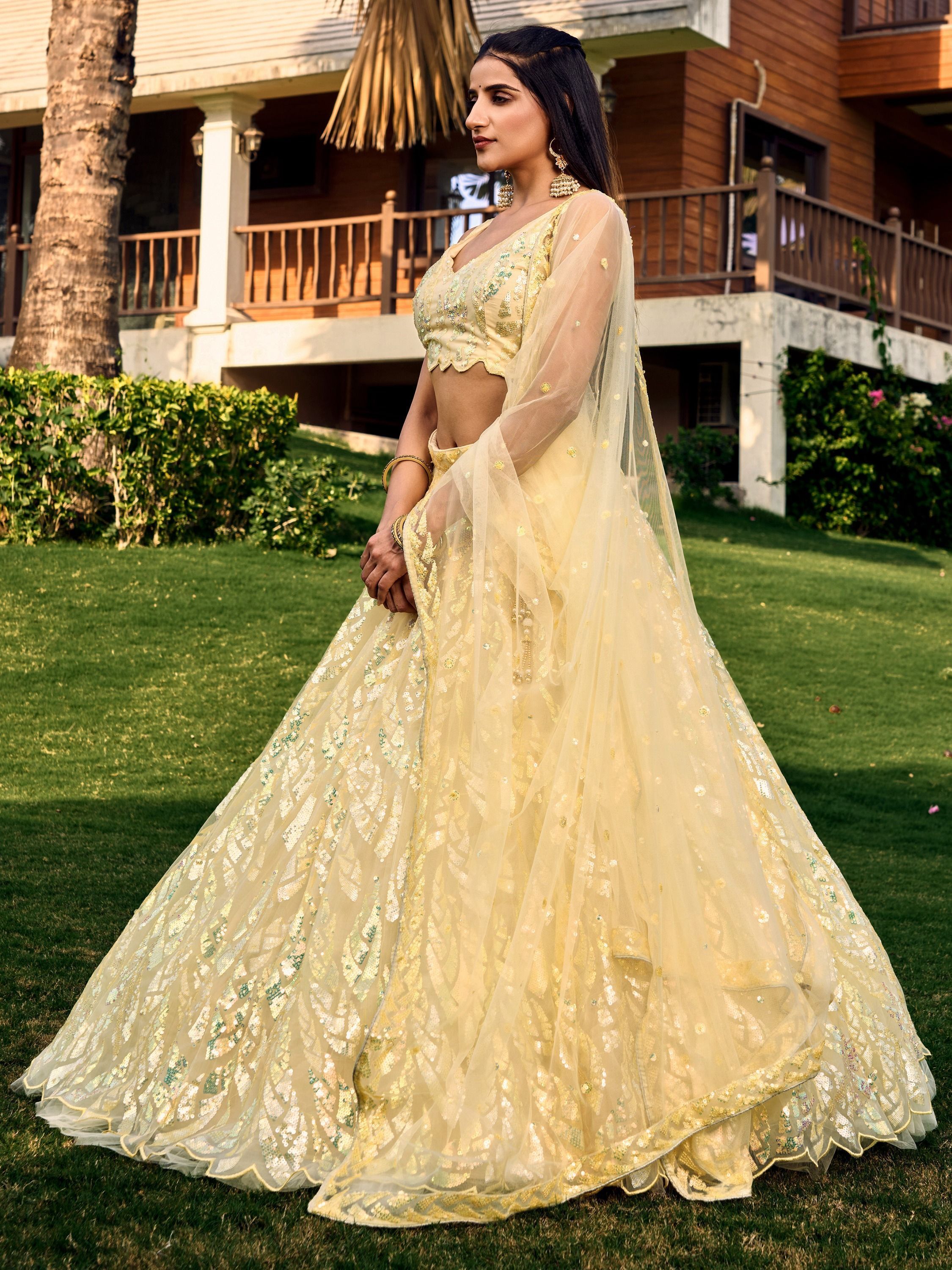 Yellow soft net lehenga choli with heavy multi sequins embroidery and lace border dupatta perfect for weddings receptions and glam parties