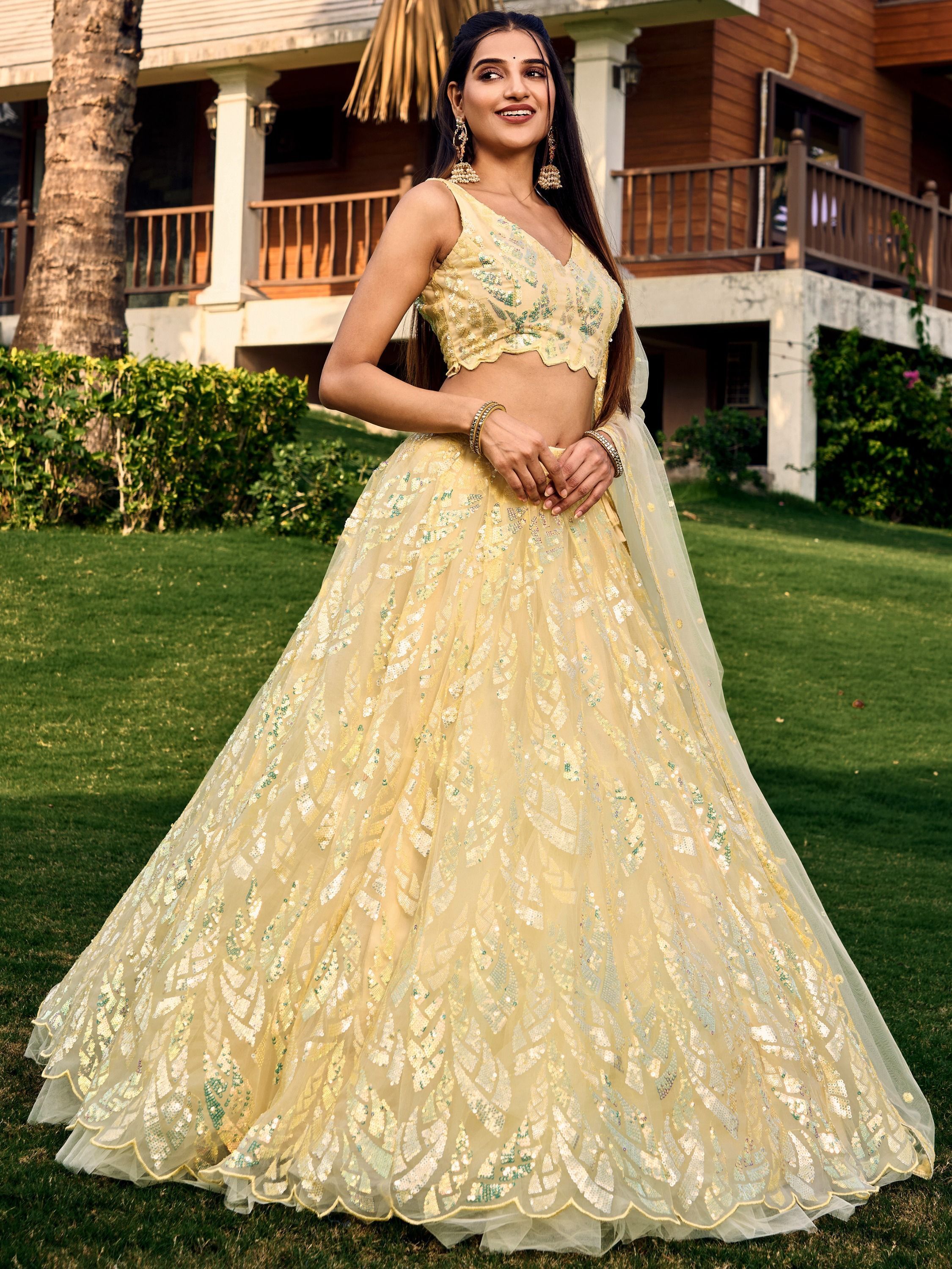 Yellow soft net lehenga choli with heavy multi sequins embroidery and lace border dupatta perfect for weddings receptions and glam parties