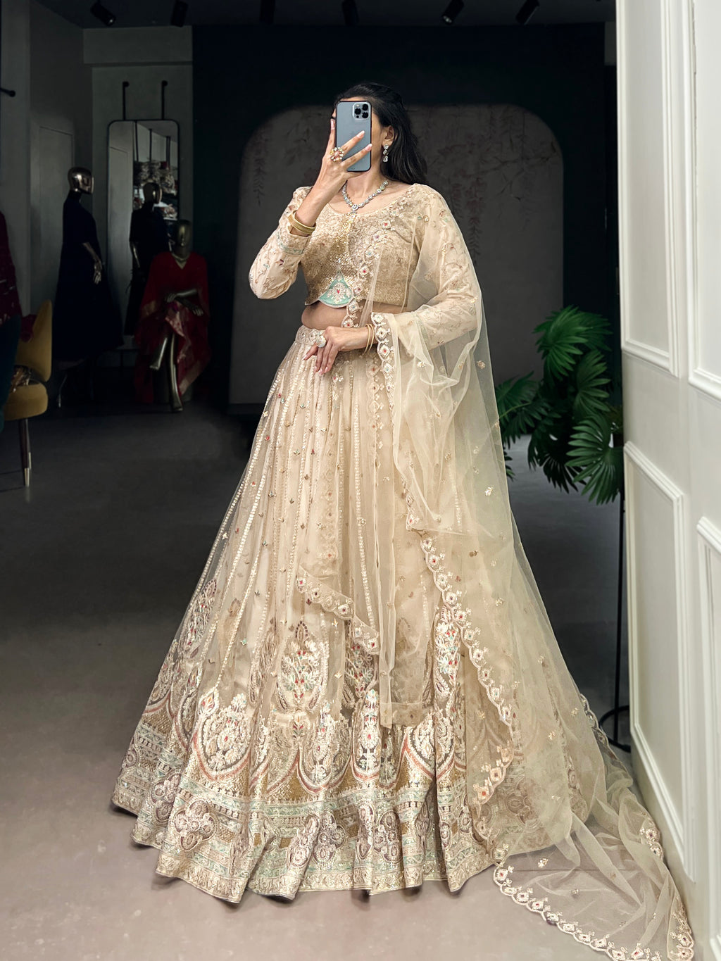 Cream net sequins thread embroidery lehenga choli with dupatta
