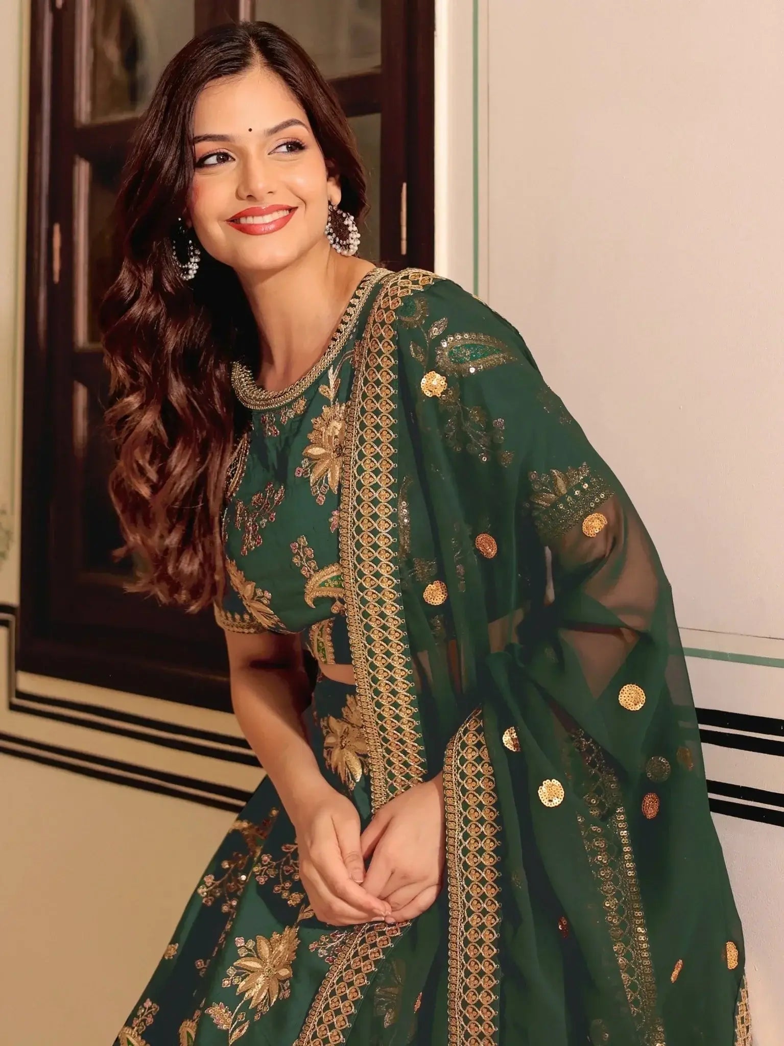 Dark green silk lehenga choli with thread zari dori sequins work