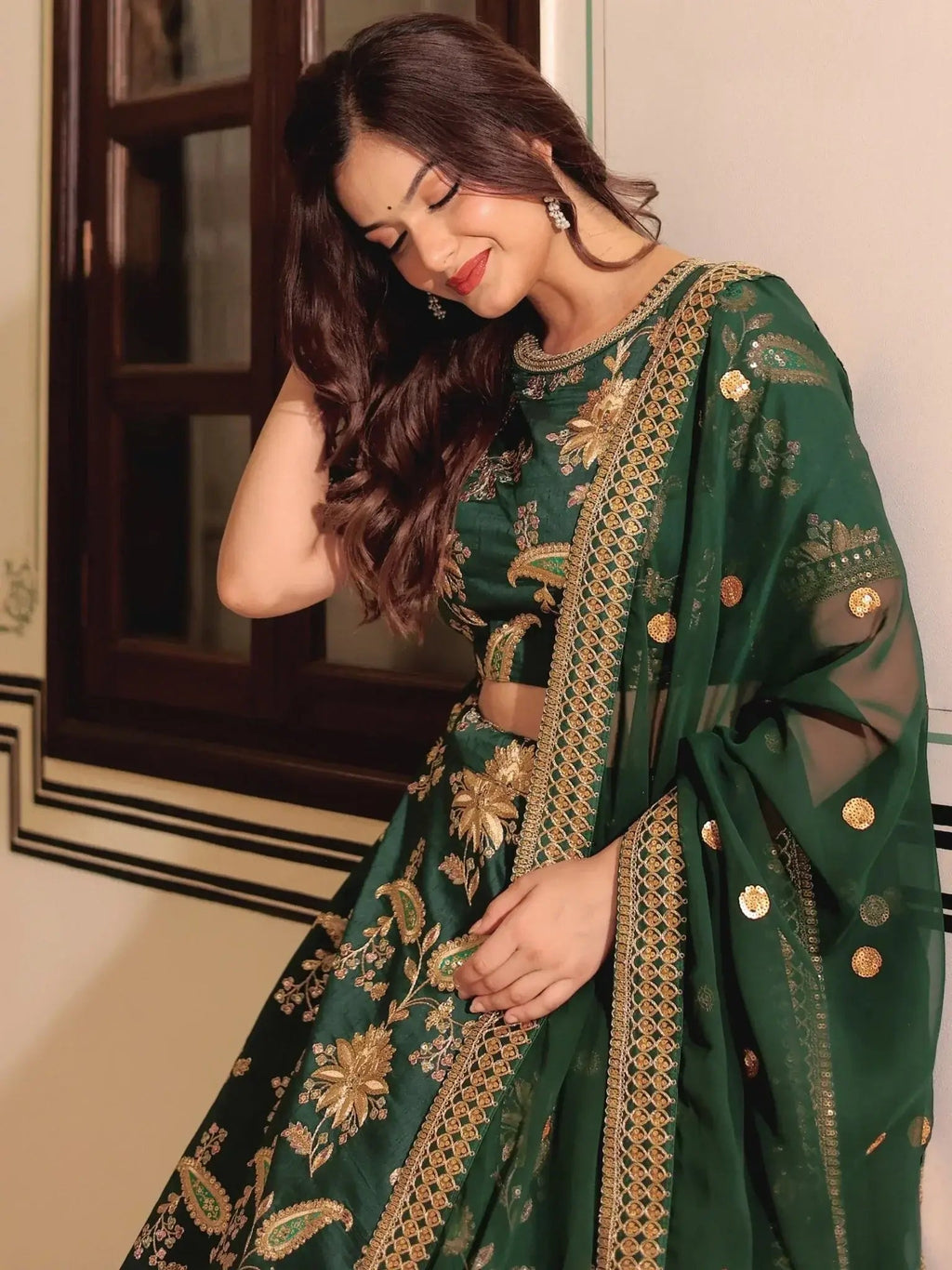 Dark green silk lehenga choli with thread zari dori sequins work