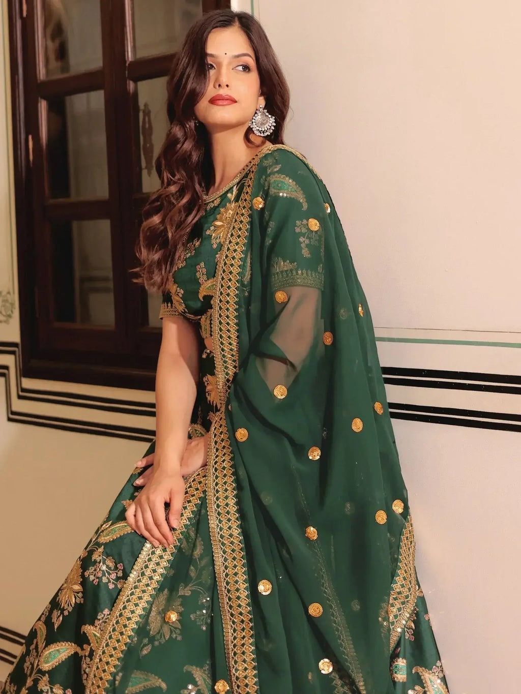 Dark green silk lehenga choli with thread zari dori sequins work