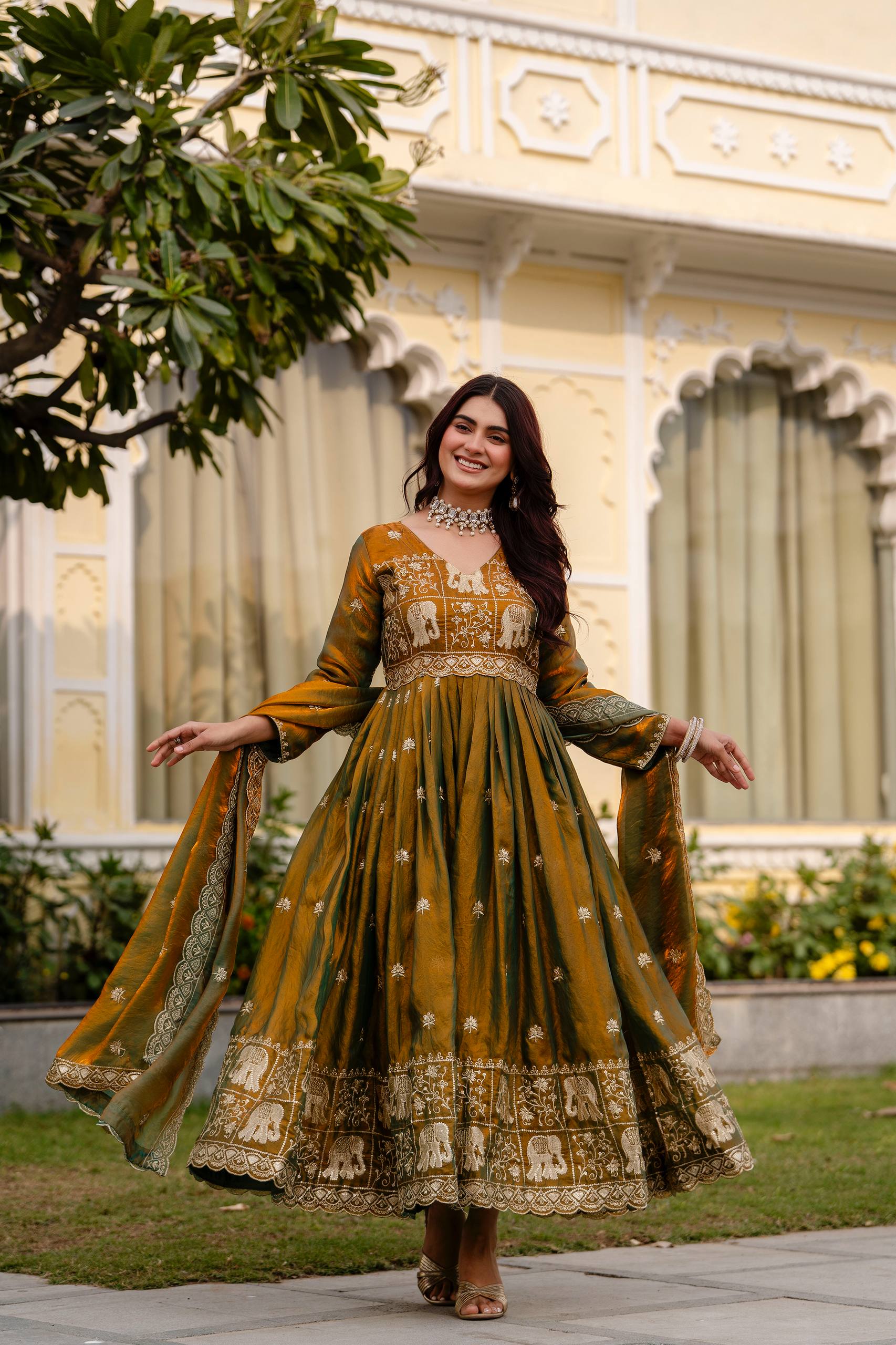 Krishnaveni olive green fendy satin embroidered gown with dupatta