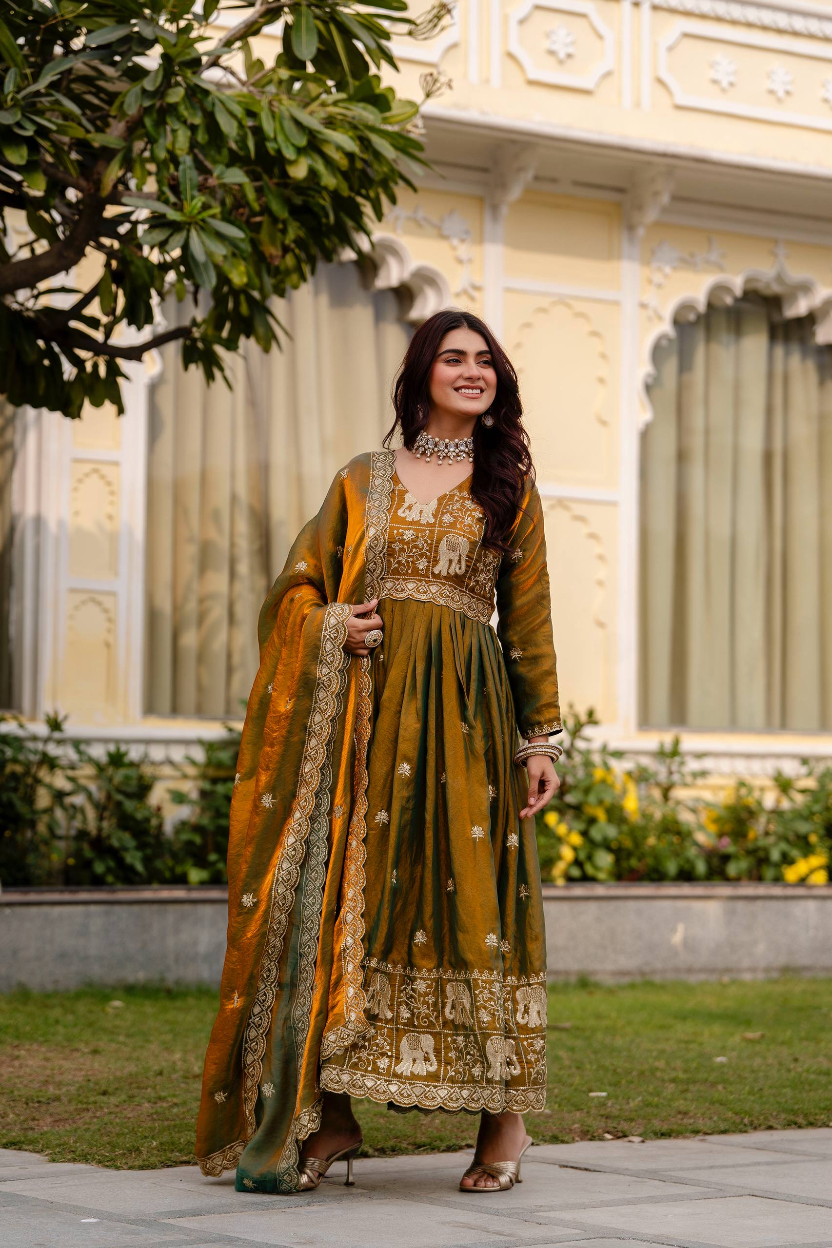 Krishnaveni olive green fendy satin embroidered gown with dupatta