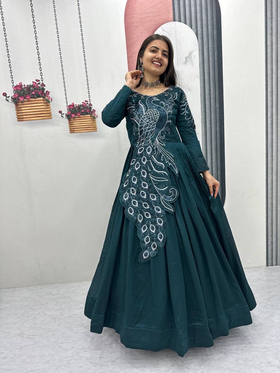 Meenakshi teal green vichitra silk embroidered peacock designed gown