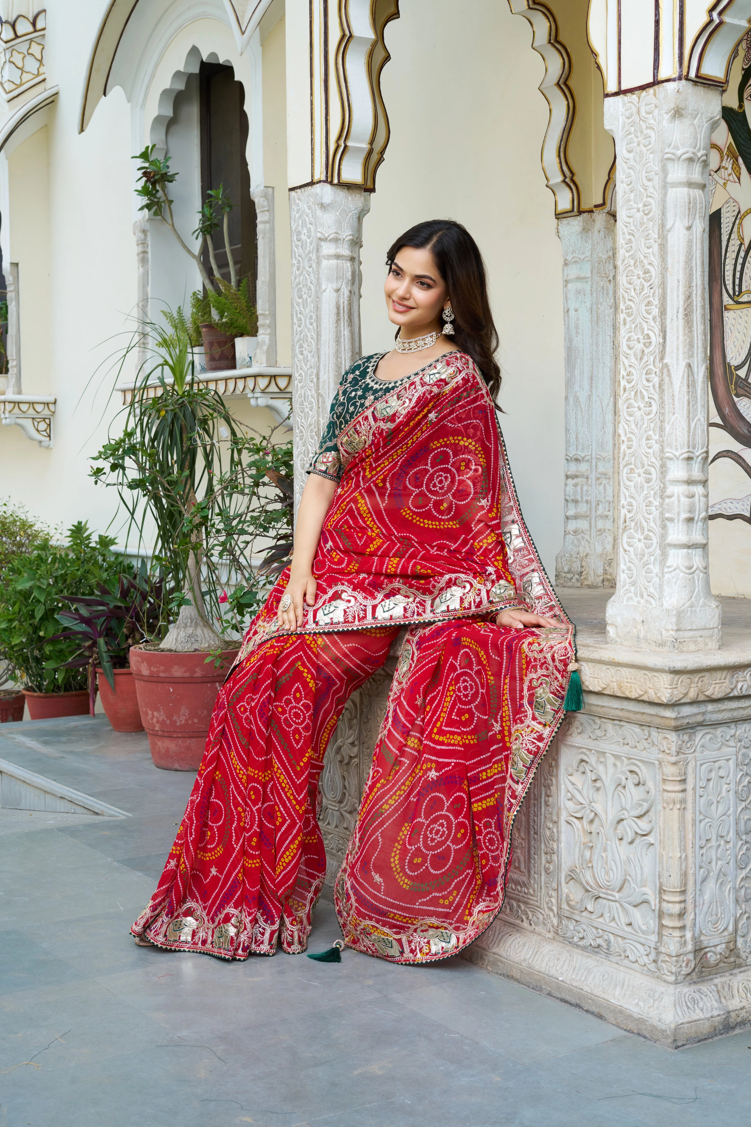 Mrinalini red gota patti work pure bandhani saree