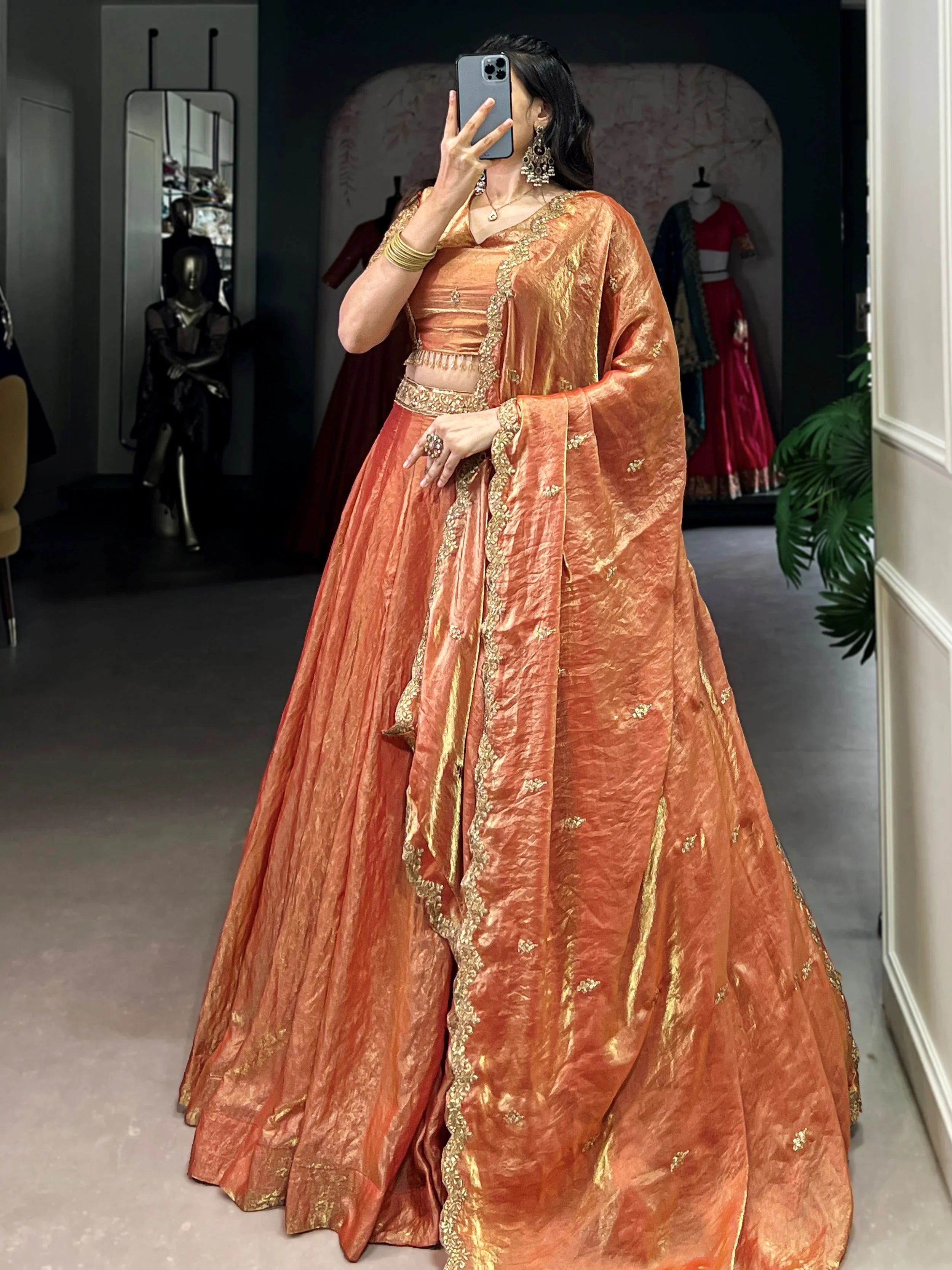 Orange fendi embroidered lehenga choli with sequins thread work dupatta