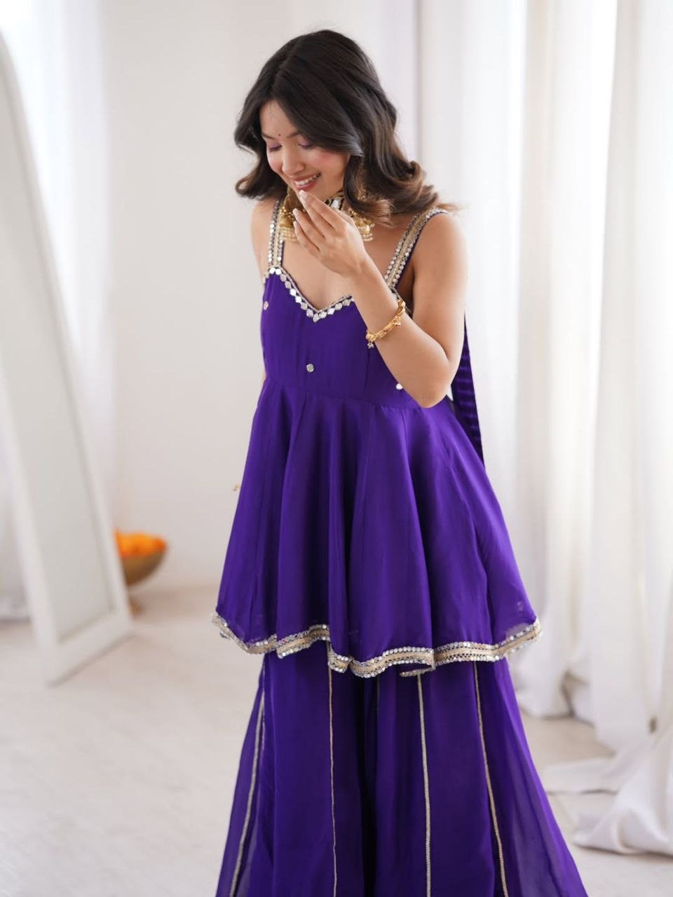 Royal Purple Silk Sharara Set with Mirror-Embellished Strappy Kurti, Pearl Detailing, Layered Flair & Gota Patti Borders