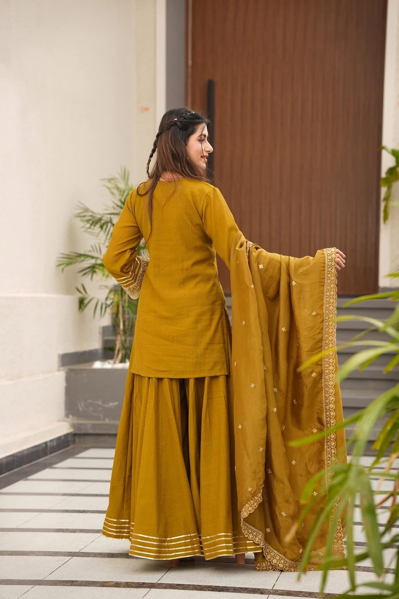Royal Mustard Yellow Chanderi-Style Kurta Sharara Ensemble with Intricate Gota Work & Tassel-Detail Dupatta