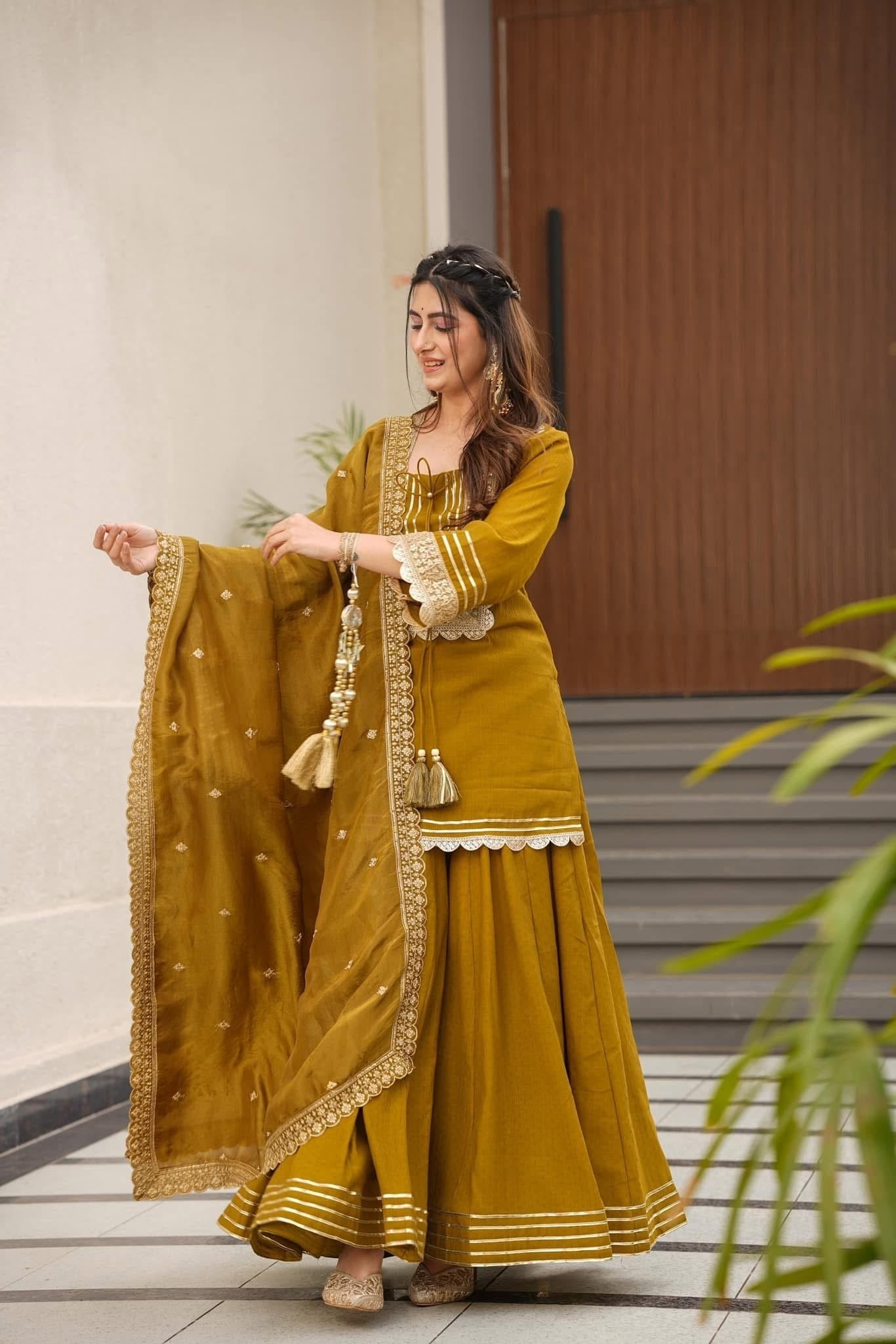 Royal Mustard Yellow Chanderi-Style Kurta Sharara Ensemble with Intricate Gota Work & Tassel-Detail Dupatta