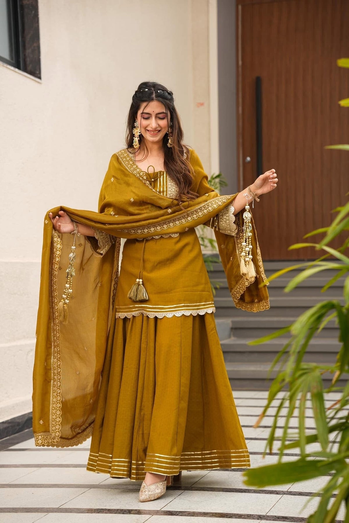 Royal Mustard Yellow Chanderi-Style Kurta Sharara Ensemble with Intricate Gota Work & Tassel-Detail Dupatta
