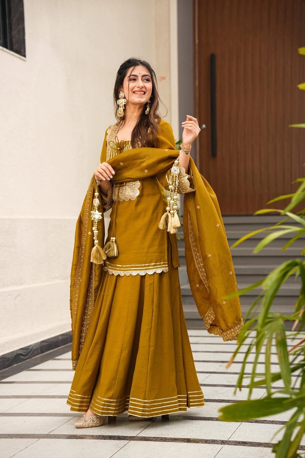 Royal Mustard Yellow Chanderi-Style Kurta Sharara Ensemble with Intricate Gota Work & Tassel-Detail Dupatta