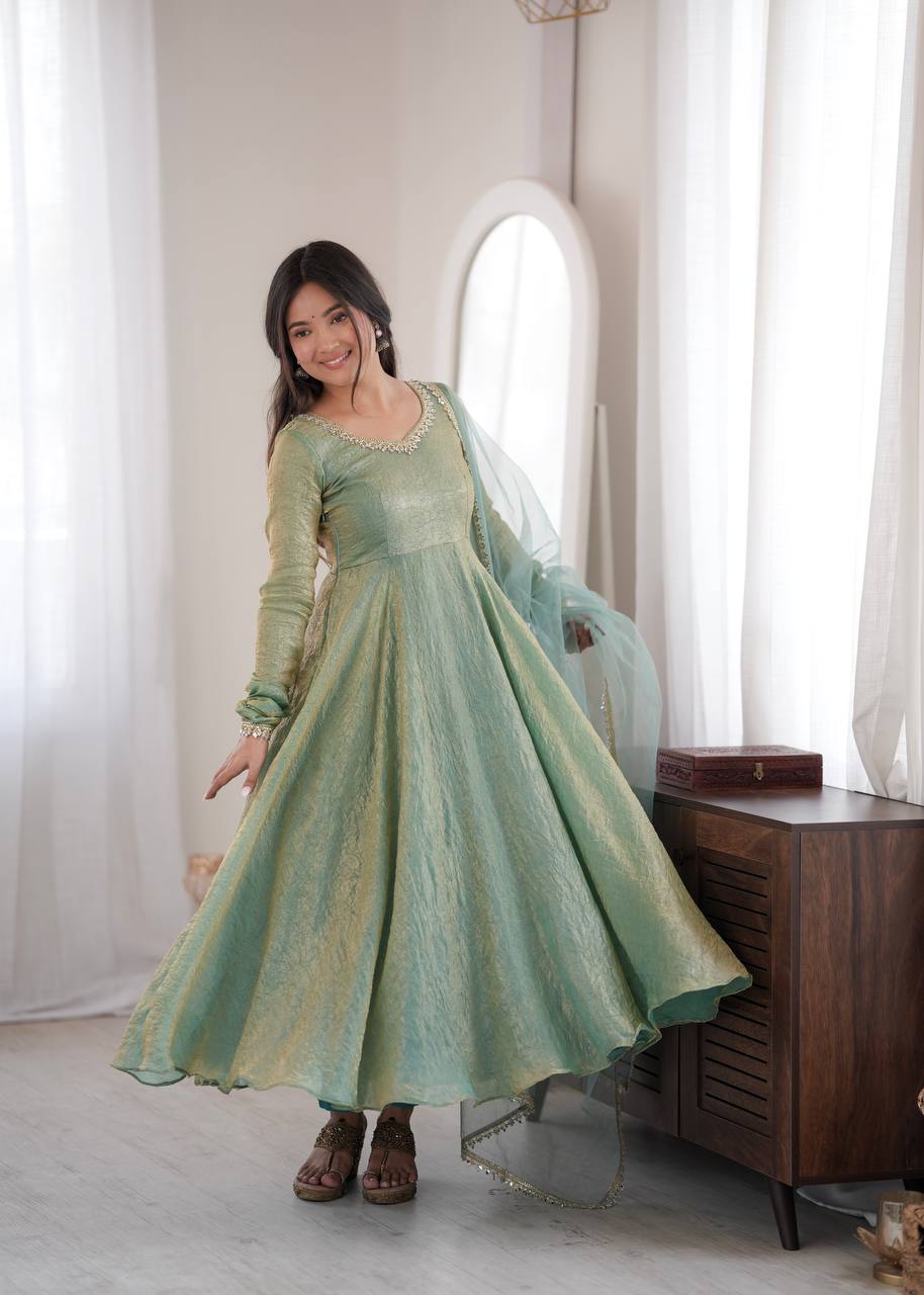 Elegant Mint Green Silk Anarkali Gown with Embellished Neckline & Sheer Dupatta