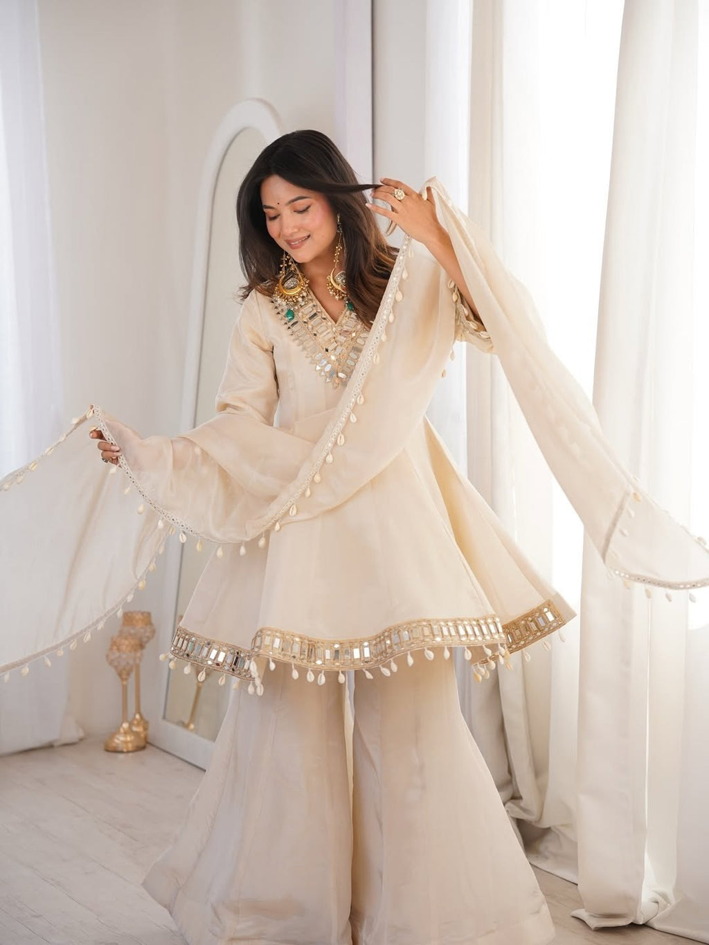 Ivory Luxe Mirror Work Sharara Set with Intricate Embroidered Neckline, Statement Sleeve Detailing & Pearl Tassel Dupatta