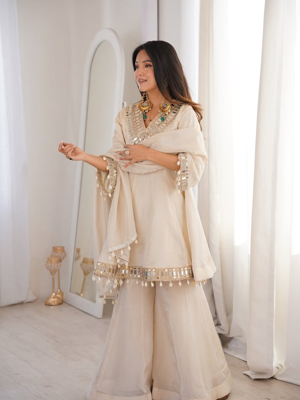 Ivory Luxe Mirror Work Sharara Set with Intricate Embroidered Neckline, Statement Sleeve Detailing & Pearl Tassel Dupatta