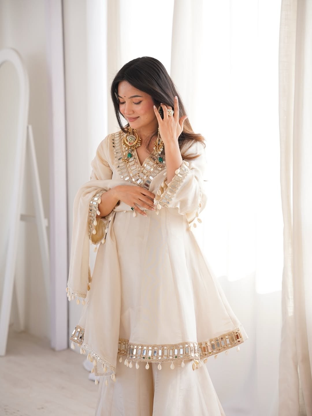 Ivory Luxe Mirror Work Sharara Set with Intricate Embroidered Neckline, Statement Sleeve Detailing & Pearl Tassel Dupatta