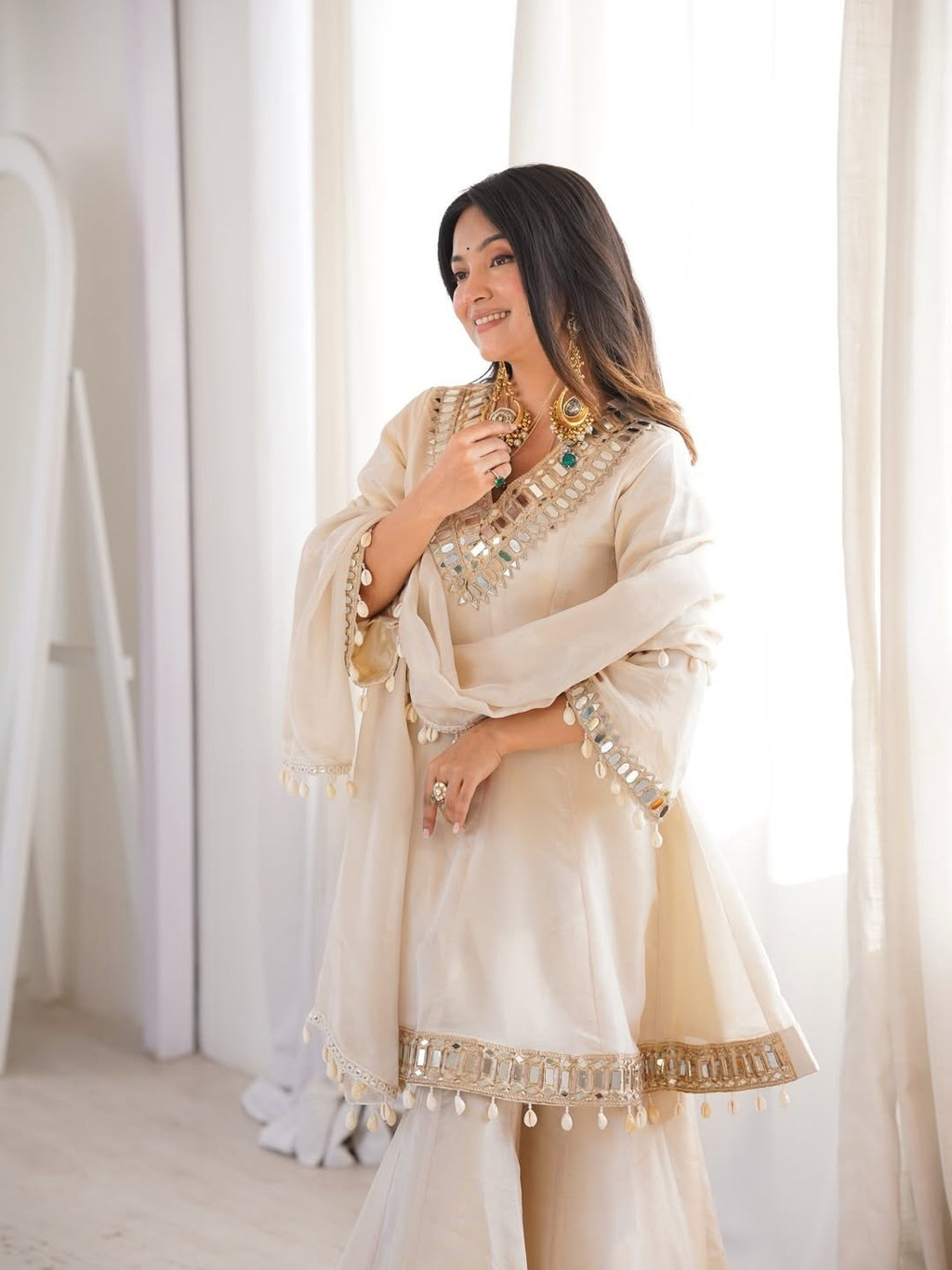 Ivory Luxe Mirror Work Sharara Set with Intricate Embroidered Neckline, Statement Sleeve Detailing & Pearl Tassel Dupatta