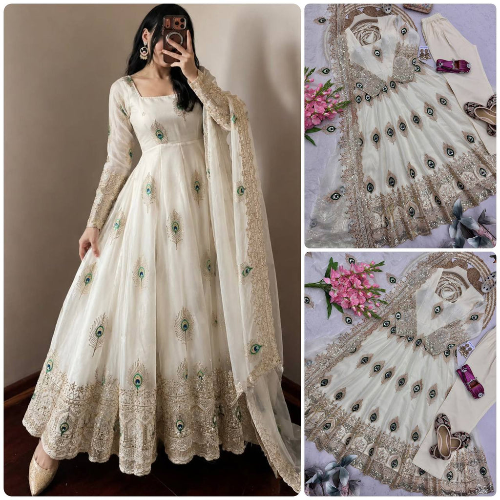 Ivory Peacock Motif Anarkali Set – A Graceful Flared Silhouette Adorned with Delicate Peacock Motifs, Intricate Gold Embroidery, Ornate Hem Border and a Matching Embroidered Dupatta.