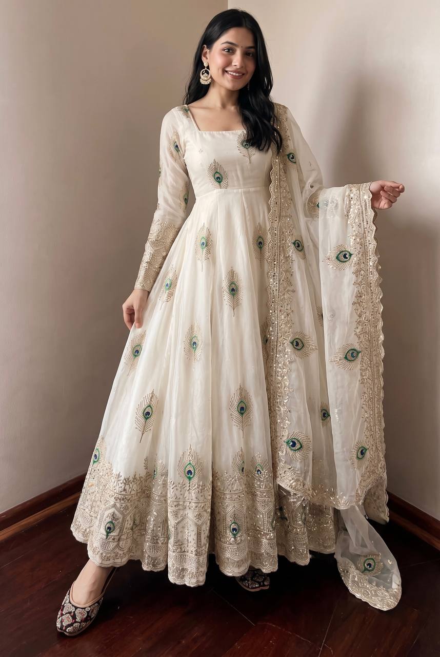 Ivory Peacock Motif Anarkali Set – A Graceful Flared Silhouette Adorned with Delicate Peacock Motifs, Intricate Gold Embroidery, Ornate Hem Border and a Matching Embroidered Dupatta.