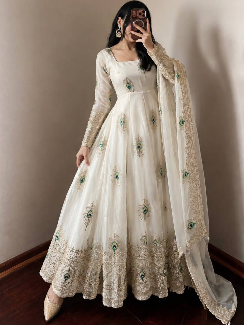 Ivory Peacock Motif Anarkali Set – A Graceful Flared Silhouette Adorned with Delicate Peacock Motifs, Intricate Gold Embroidery, Ornate Hem Border and a Matching Embroidered Dupatta.