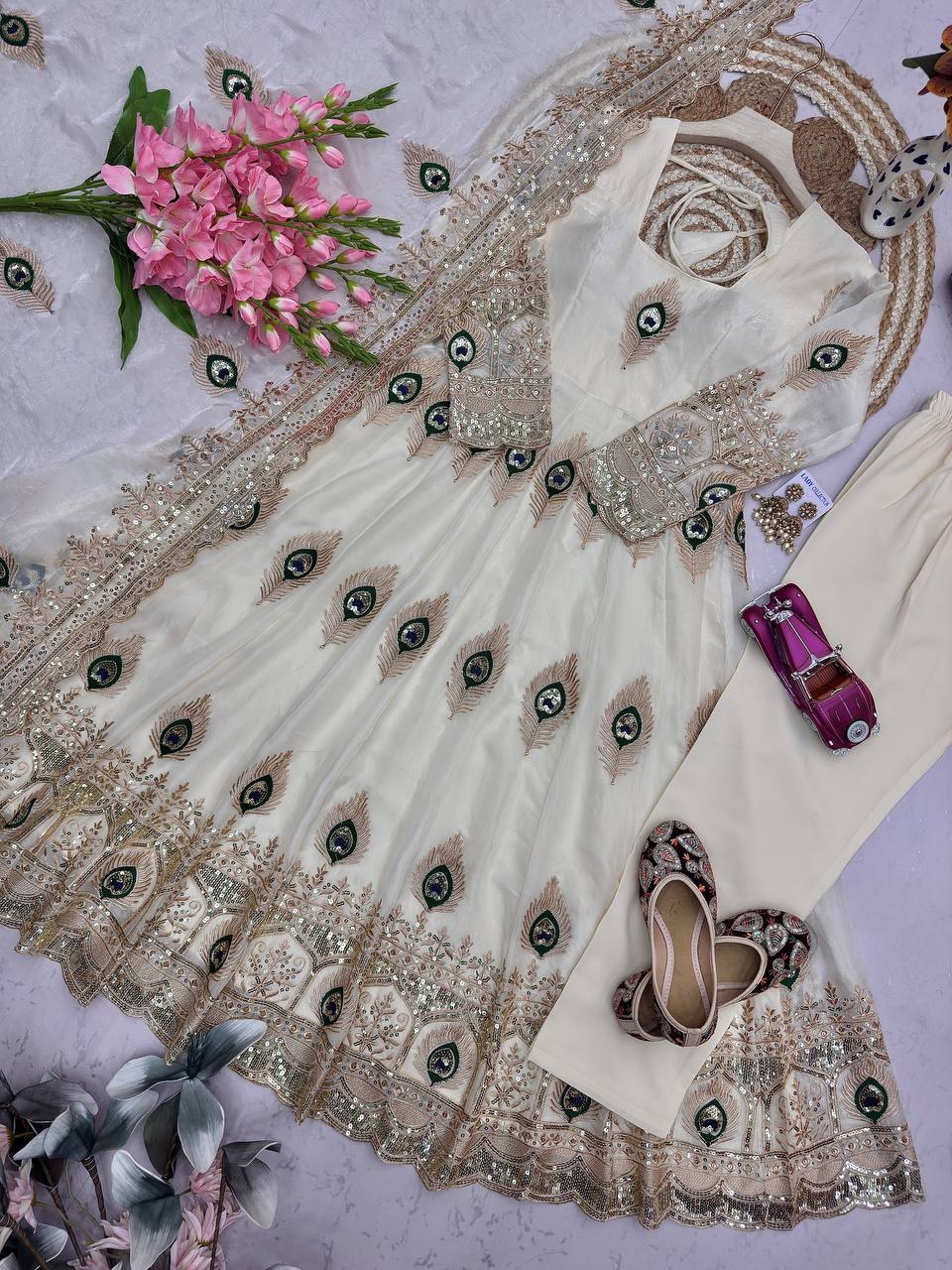 Ivory Peacock Motif Anarkali Set – A Graceful Flared Silhouette Adorned with Delicate Peacock Motifs, Intricate Gold Embroidery, Ornate Hem Border and a Matching Embroidered Dupatta.