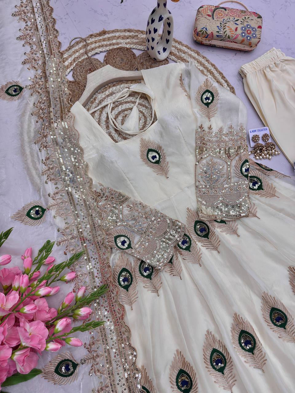 Ivory Peacock Motif Anarkali Set – A Graceful Flared Silhouette Adorned with Delicate Peacock Motifs, Intricate Gold Embroidery, Ornate Hem Border and a Matching Embroidered Dupatta.