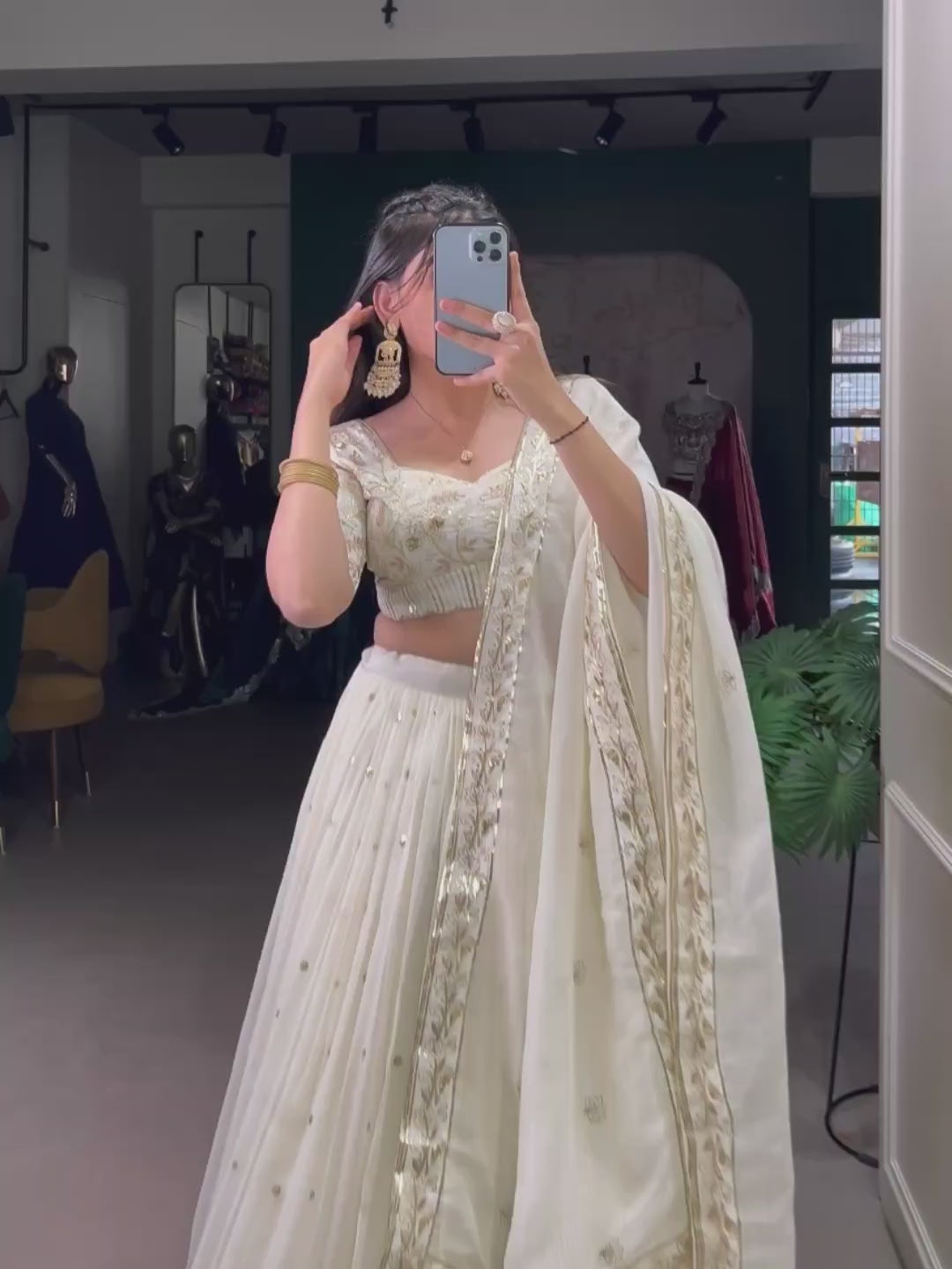 The **Dharvika Off-White Embroidered Lehenga Choli** is a masterpiece of elegance, designed for those who appreciate regal charm with a modern touch. Crafted from **luxurious Silver Glossy fabric**, this **designer lehenga choli** is adorned with **sequins, intricate embroidery, and foil work**, making it an ideal choice for **weddings, receptions, sangeet, and festive celebrations like Diwali**.

With a **majestic 3.5-meter flair**, stitched **canvas and can-can lining**, and a **soft micro cotton inner**,