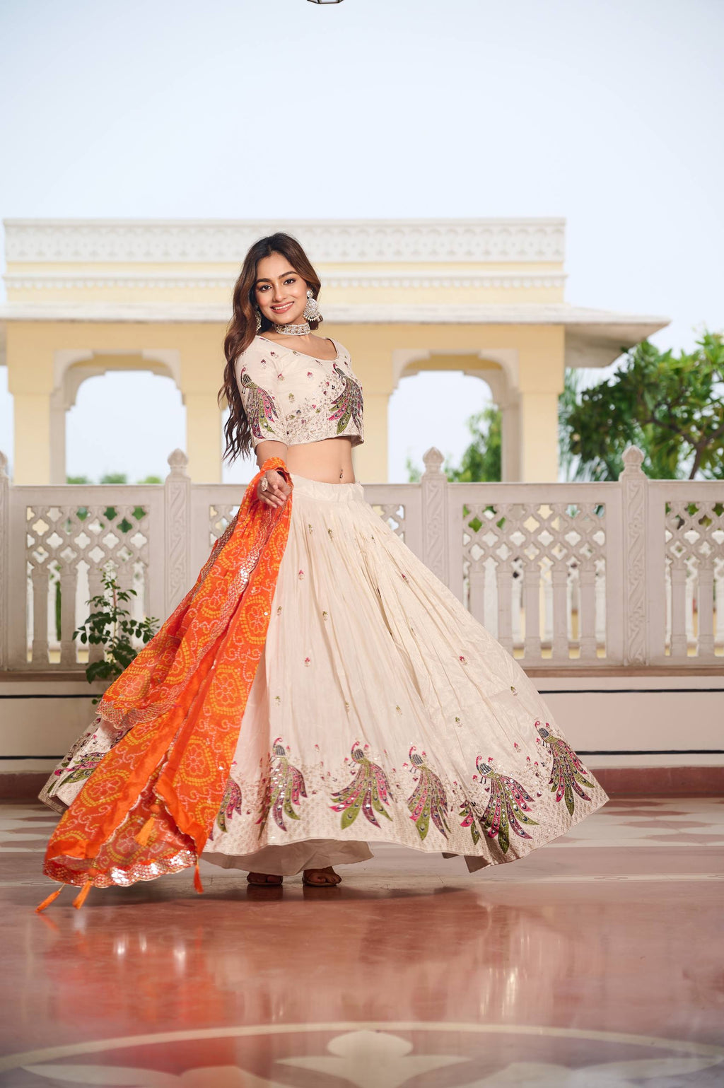 Amla off-white tissue silk lehenga choli with sequins thread work and orange Bandhej dupatta