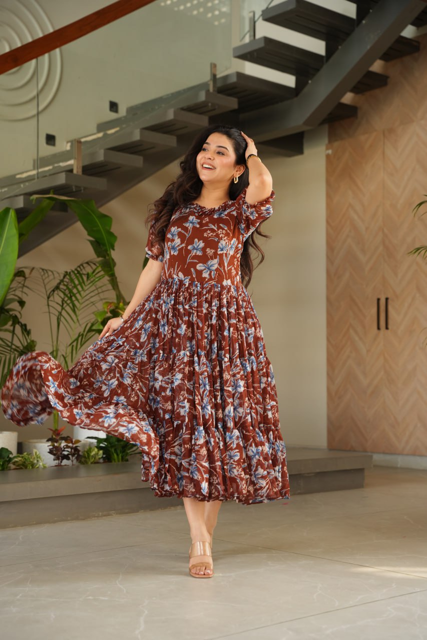 Vikarni Brown Printed Anarkali Gown in faux georgette with 12-meter flair & cotton lining – perfect for haldi, mehndi, festive & Indo-western occasions.