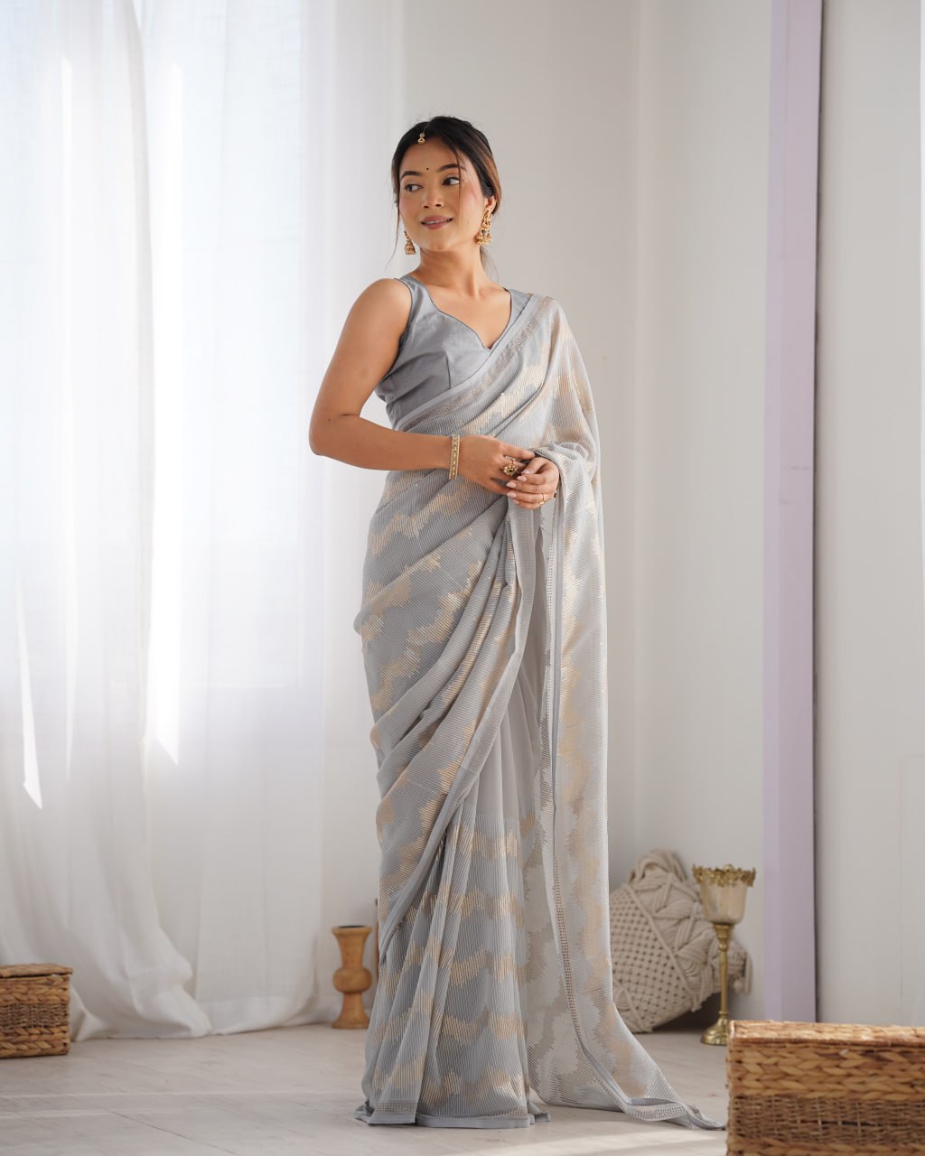 Graceful Aira Grey Georgette saree with heavy sequin embroidery and Seroski diamond embellishments, paired with an unstitched satin Banglori blouse – ideal bridal saree, festive saree, designer grey saree, elegant ethnic party wear, and luxury embroidered saree for women.