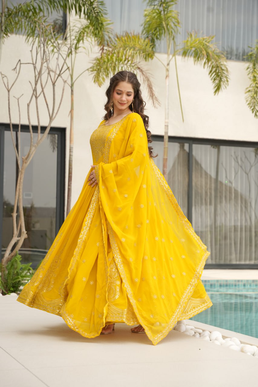 Yellow wedding gown for women with dupatta, embroidered gown design, full sleeve gown, Indian ethnic gown, stitched designer gown by Trinaari.