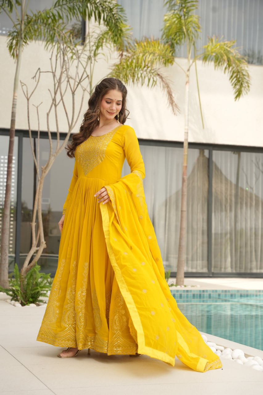Yellow wedding gown for women with dupatta, embroidered gown design, full sleeve gown, Indian ethnic gown, stitched designer gown by Trinaari.