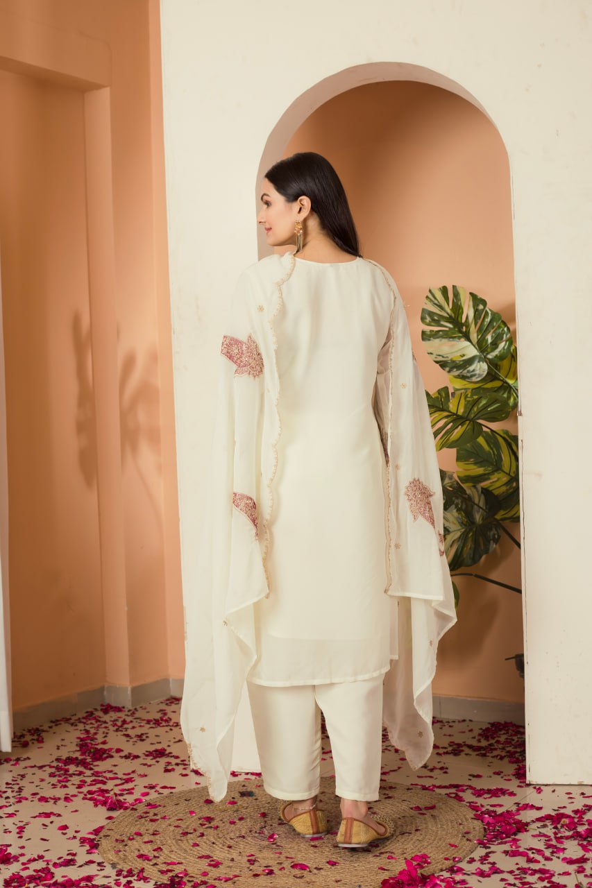 Khyati Off-White Embroidered Kurti Set crafted from premium Fox Georgette, featuring intricate heavy thread and sequins embroidery. This elegant ensemble includes a fully stitched kurti with a butter crepe lining, a matching stitched bottom, and an embroidered Fox Georgette dupatta. Designed for festive gatherings and special occasions, it beautifully blends tradition with modern sophistication