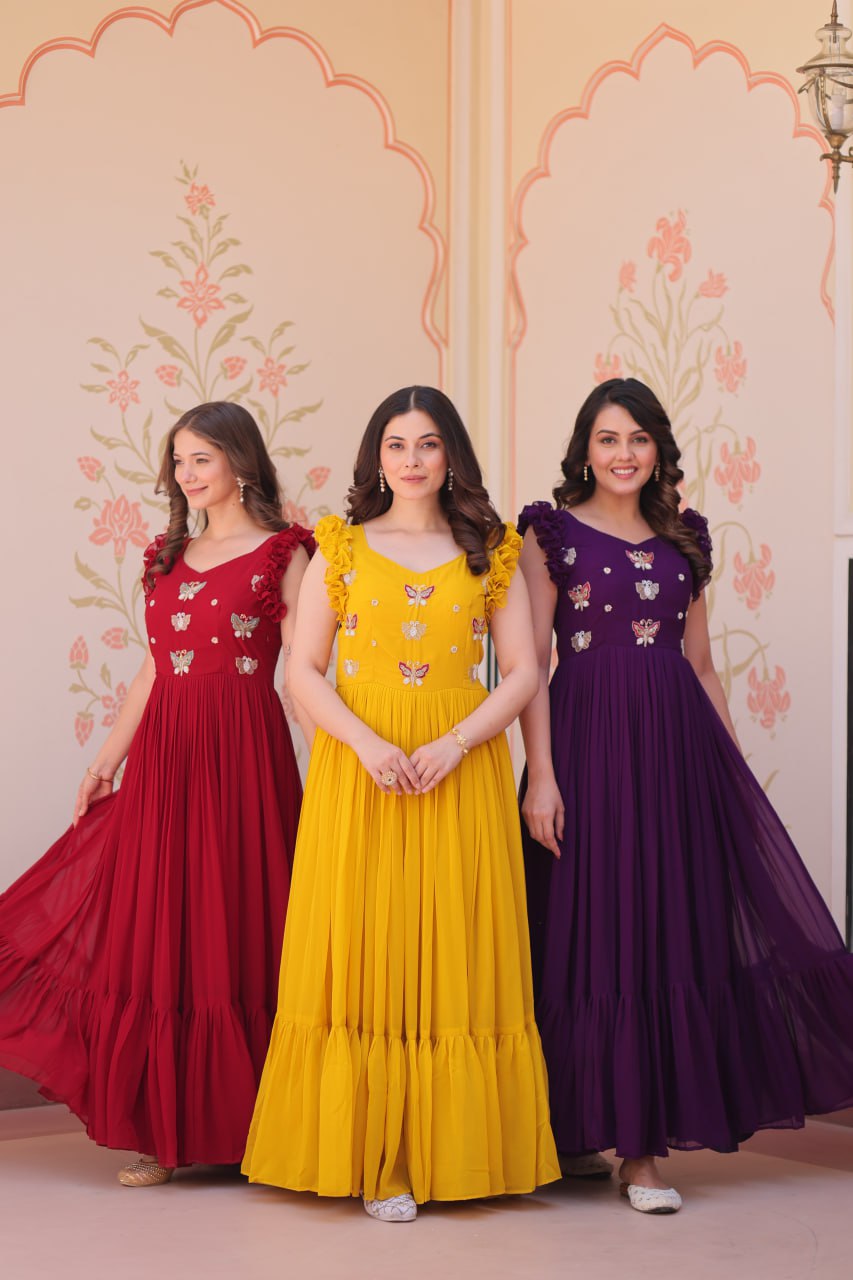 Lavi 7-meter flared designer gown in faux blooming fabric with sequin & bead embroidery, V-neck & frill shoulders – perfect for weddings & parties.