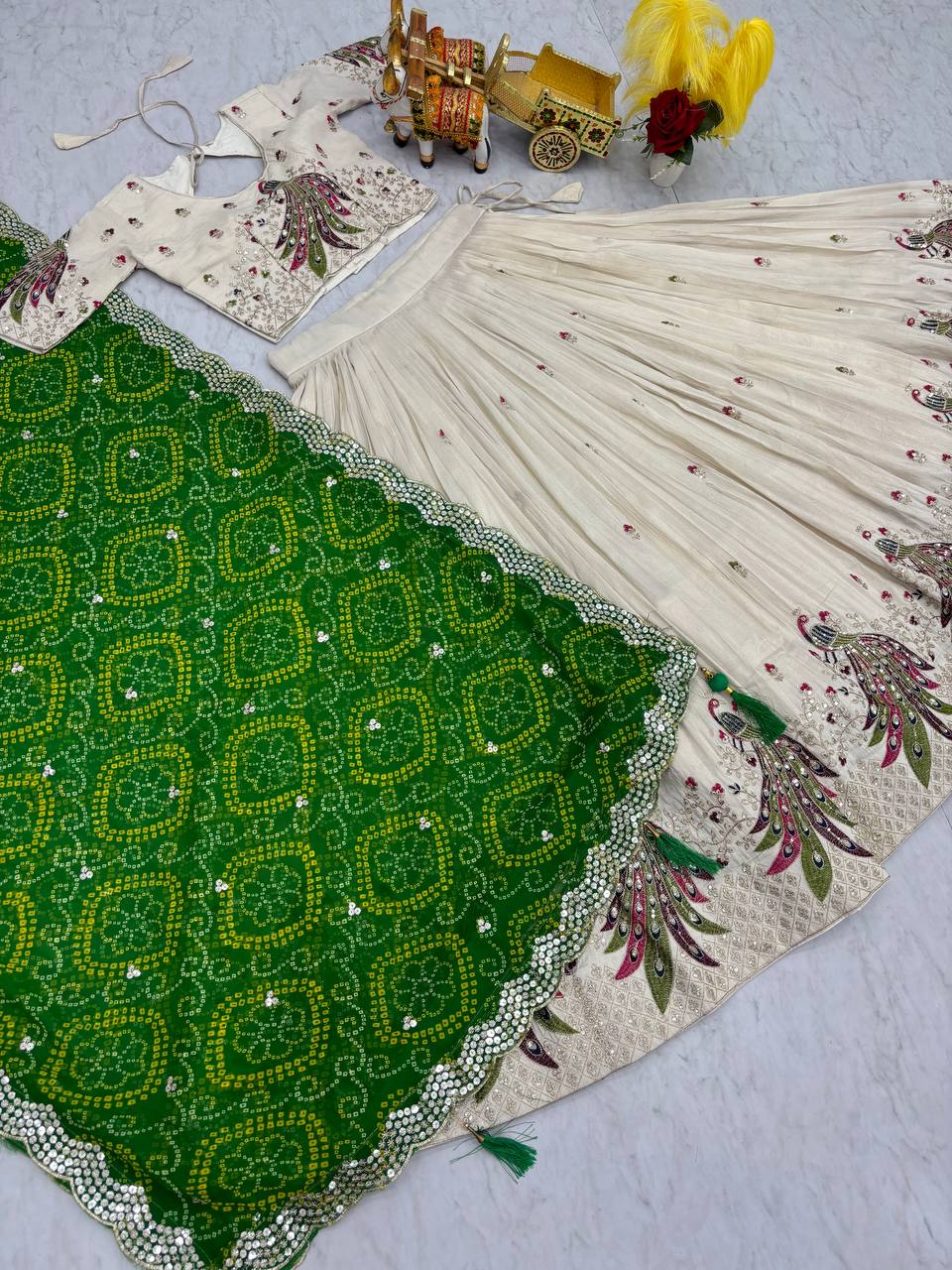 Amla off-white tissue silk lehenga choli with sequins thread work and green Bandhej dupatta