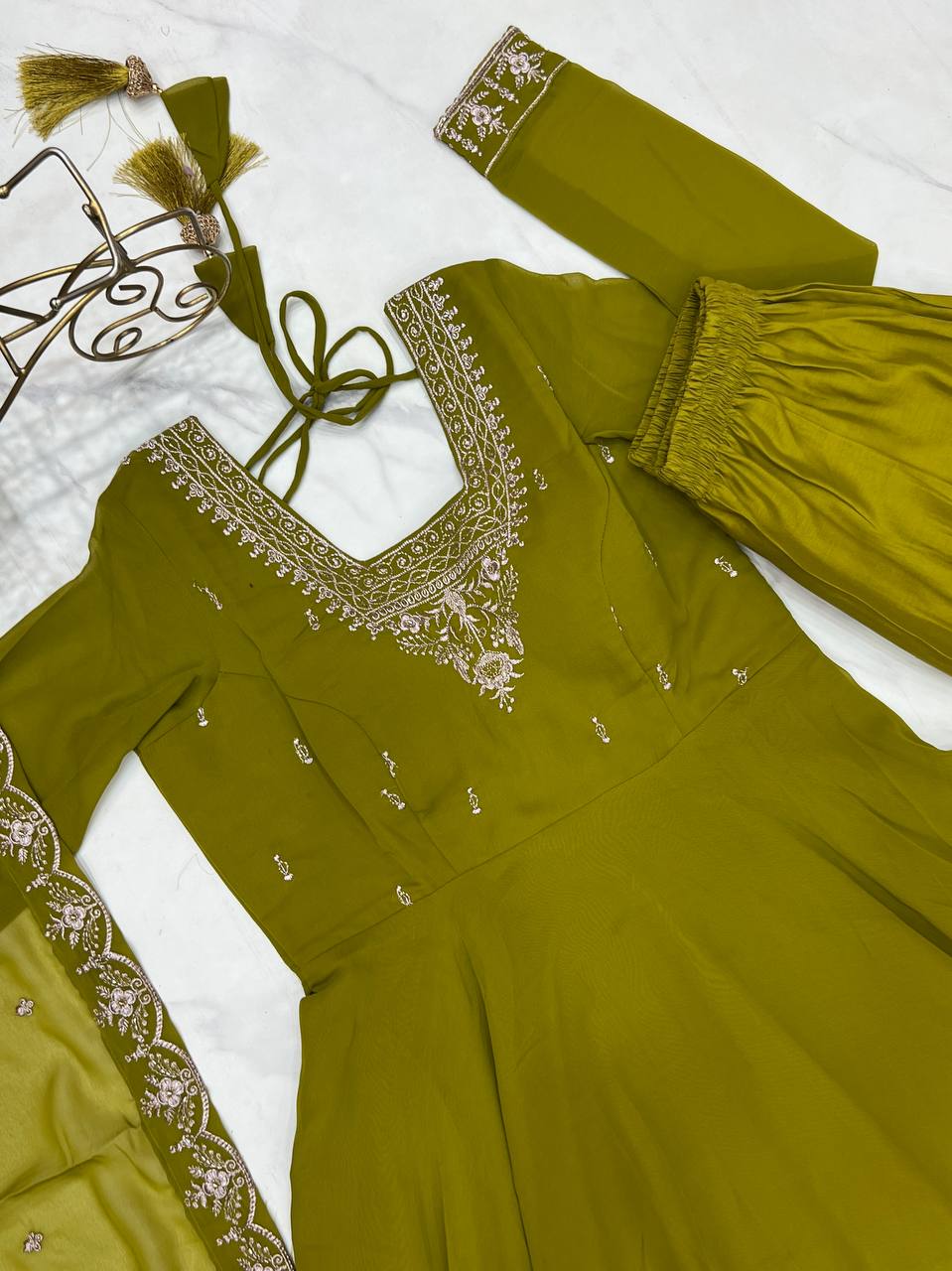 Green Anarkali suit in soft Fox Georgette with 6.5-meter flair, beads & zari embroidery, lace sleeves & dupatta – fully stitched & party-ready.