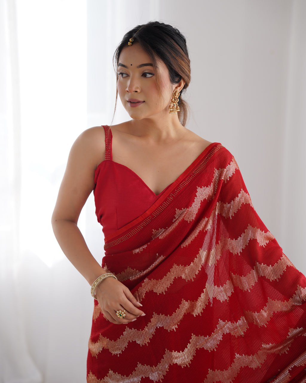 Red georgette saree with sequin & Seroski diamond work, bridal party wear saree with satin blouse, designer ethnic wear by Trinaari for weddings.