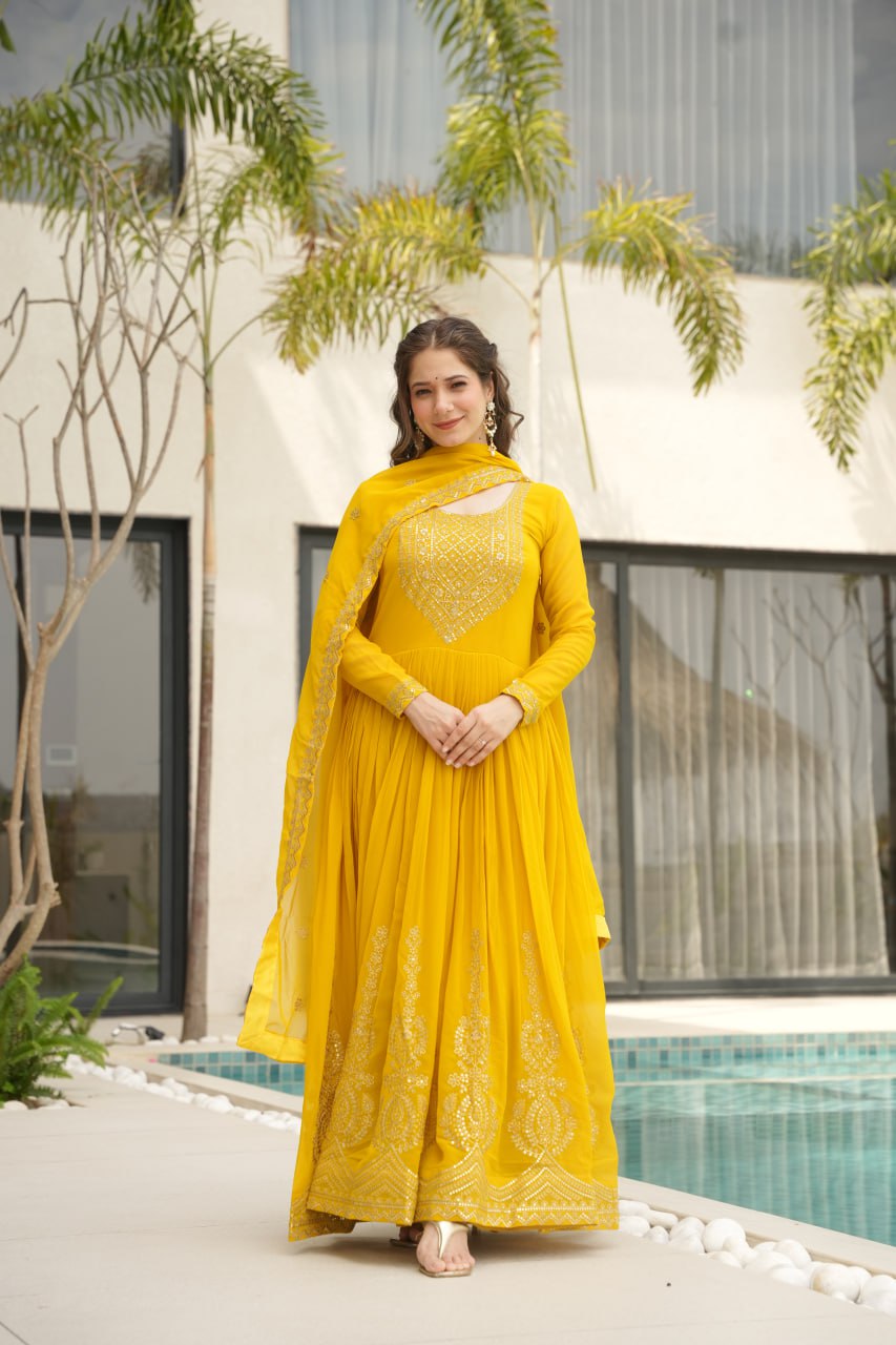 Yellow wedding gown for women with dupatta, embroidered gown design, full sleeve gown, Indian ethnic gown, stitched designer gown by Trinaari.