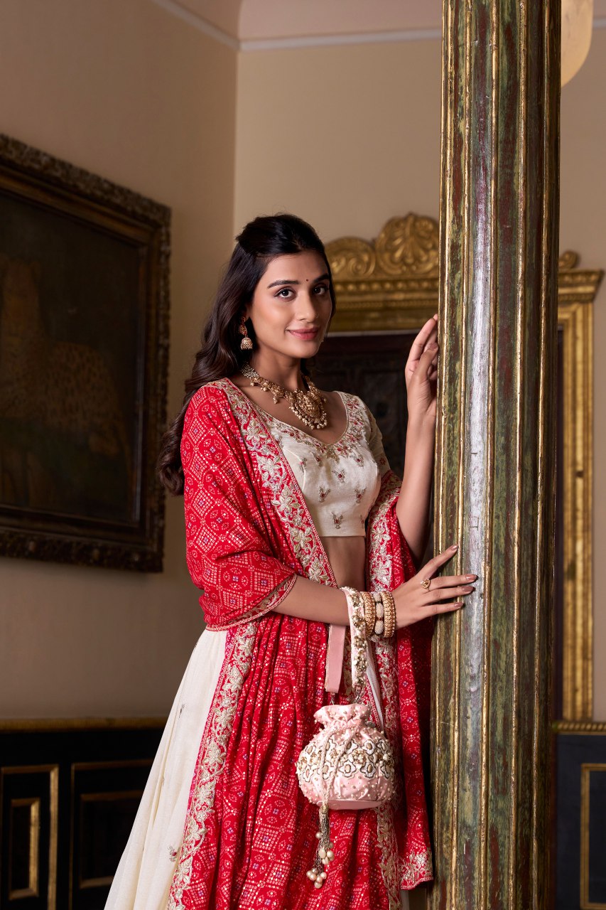 Off-white silk lehenga choli with embroidery and Bandhej print dupatta
