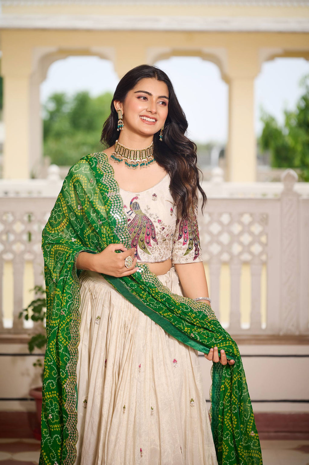 Amla off-white tissue silk lehenga choli with sequins thread work and green Bandhej dupatta