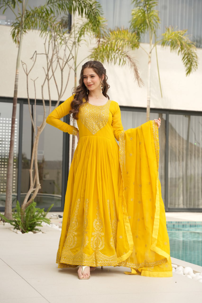 Yellow wedding gown for women with dupatta, embroidered gown design, full sleeve gown, Indian ethnic gown, stitched designer gown by Trinaari.