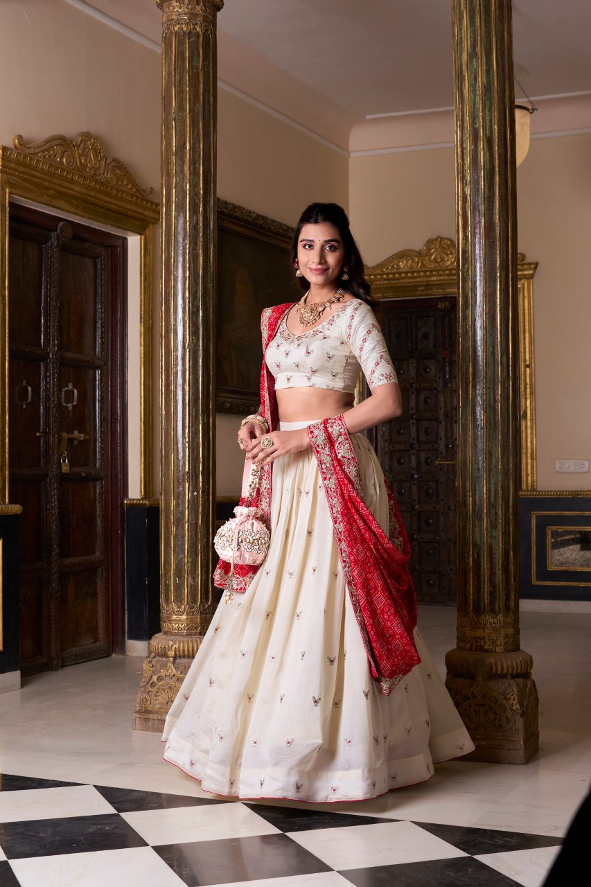 Off-white silk lehenga choli with embroidery and Bandhej print dupatta
