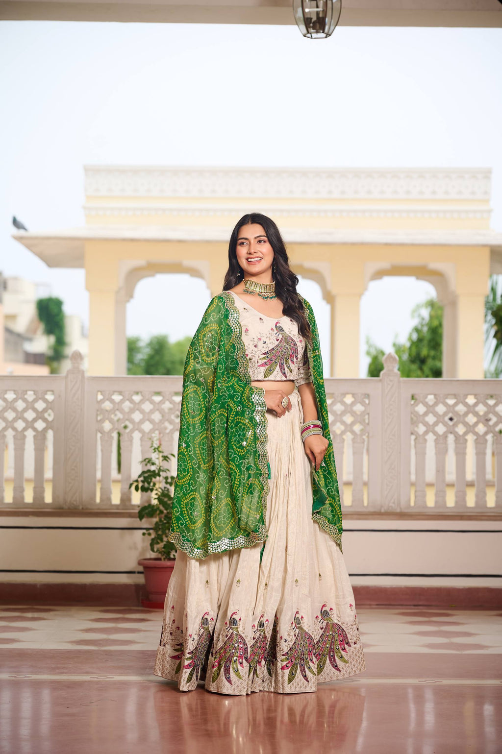 Amla off-white tissue silk lehenga choli with sequins thread work and green Bandhej dupatta