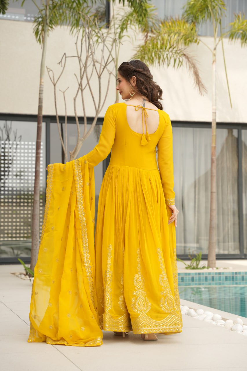 Yellow wedding gown for women with dupatta, embroidered gown design, full sleeve gown, Indian ethnic gown, stitched designer gown by Trinaari.