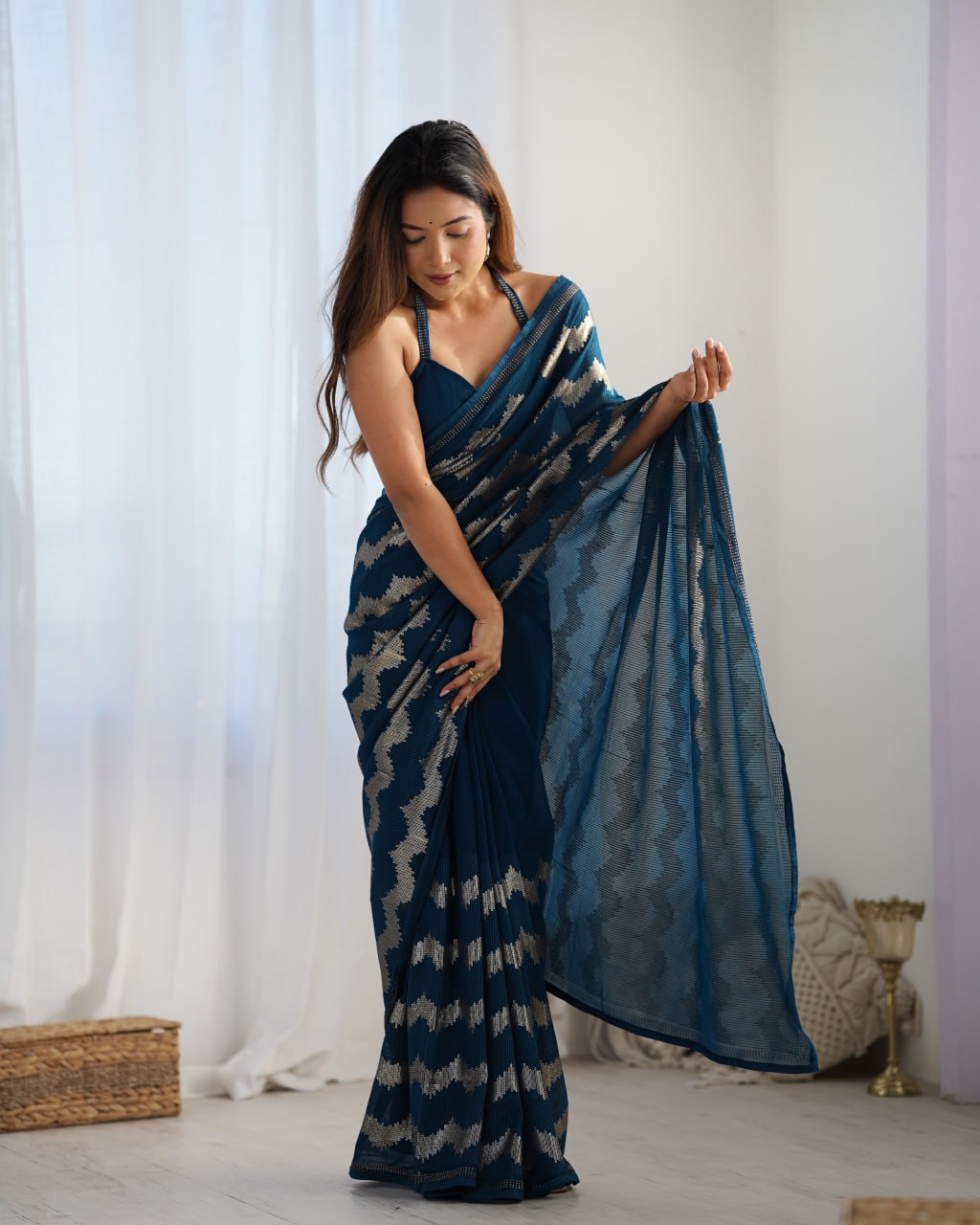 Elegant Aira Blue Georgette saree featuring heavy sequin embroidery and Seroski diamond work, paired with an unstitched satin Banglori blouse – perfect as a wedding saree, party wear saree, festive wear outfit, designer ethnic saree, and a must-have for lovers of premium georgette sarees.