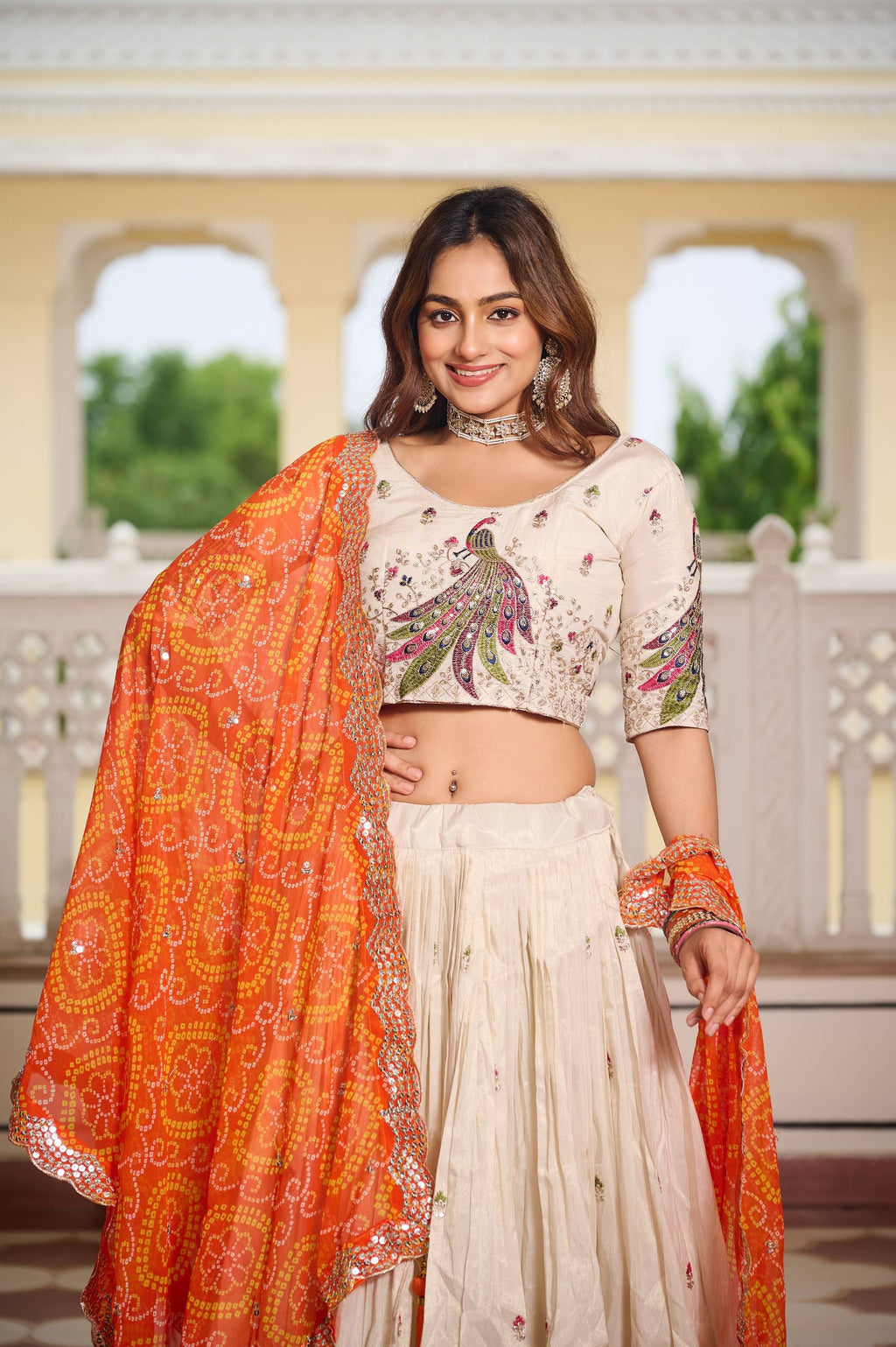 Amla off-white tissue silk lehenga choli with sequins thread work and orange Bandhej dupatta